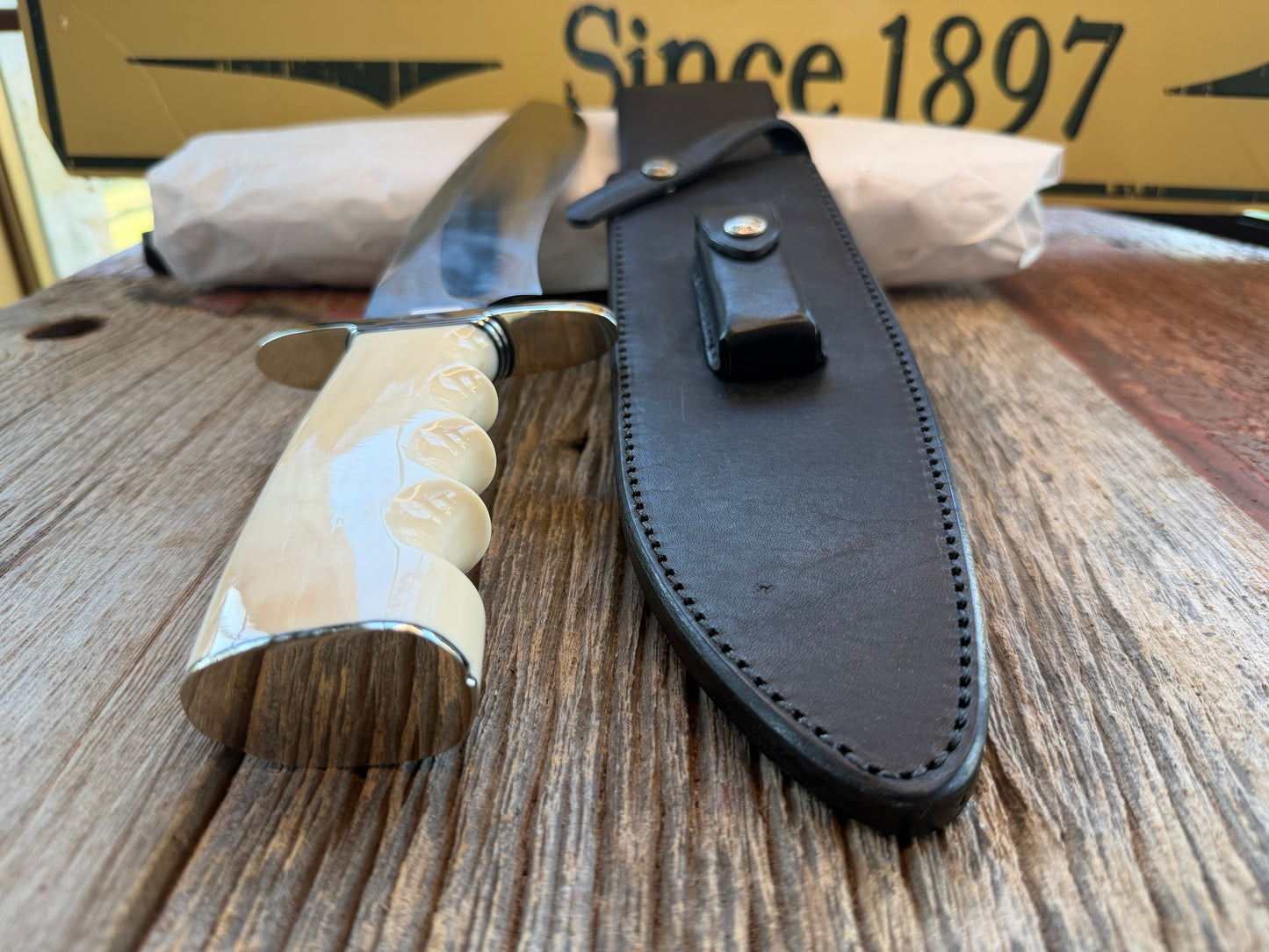 New in Paper Randall Model 12-11 Dealer Special Large Sasquatch Huge piece of Pearly White Fossil walrus Ivory, Finger Groves , # 1134 Nickel Silver Hilt and butt cap.