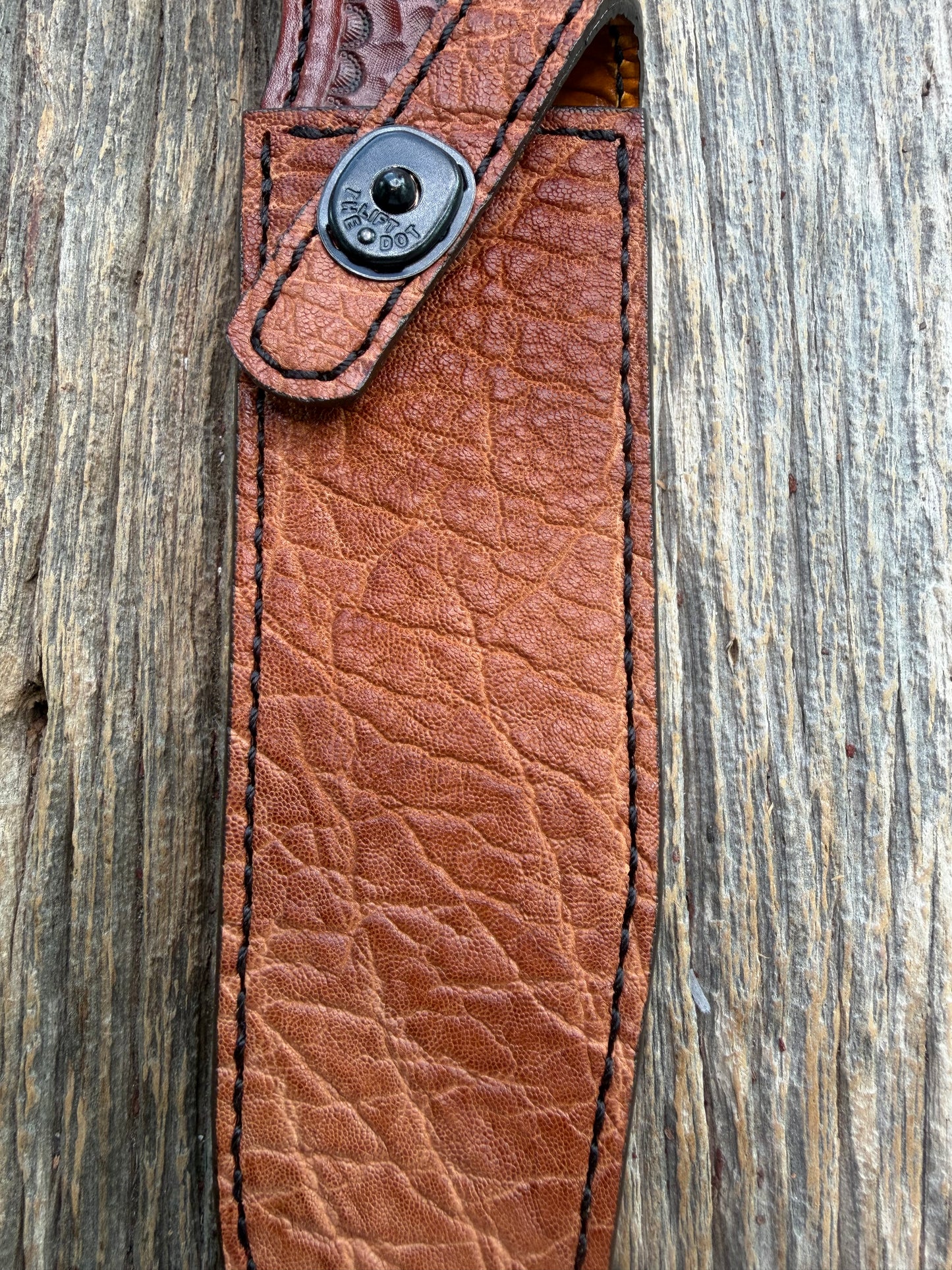 New Randall Model 1-7 Sheath in Exotic thick and textured Rust colored Elephant hide on brown leather from Treeman with a black Canteen snap. Hand tooled belt loop. Killer sheath.