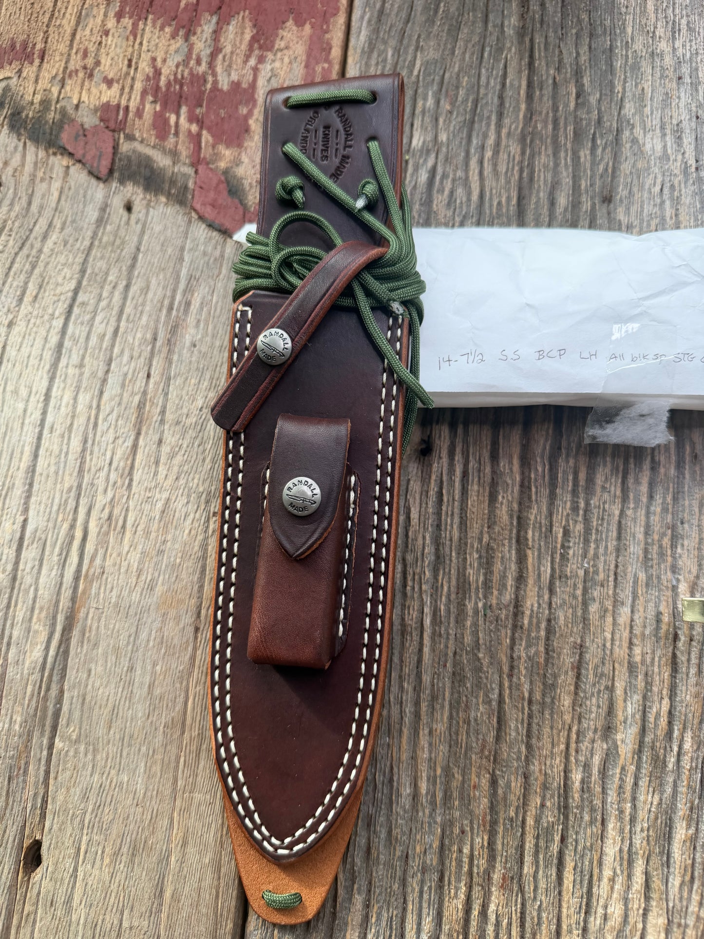 New in paper fresh from the Shop. Randall Knife Model 14-7.5 Big. Nice piece of Stag, Gorgeous Brass Lugged hilt and brass crows beak butt cap. Single black spacer. Stainless steel.