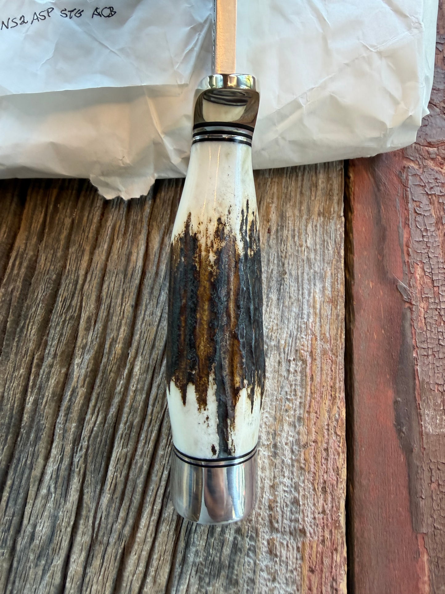 New in Paper Randall Model 19-5 with a Gnarly piece of Stag. Nickel silver Hilt and Aluminum crows beak Butt cap.