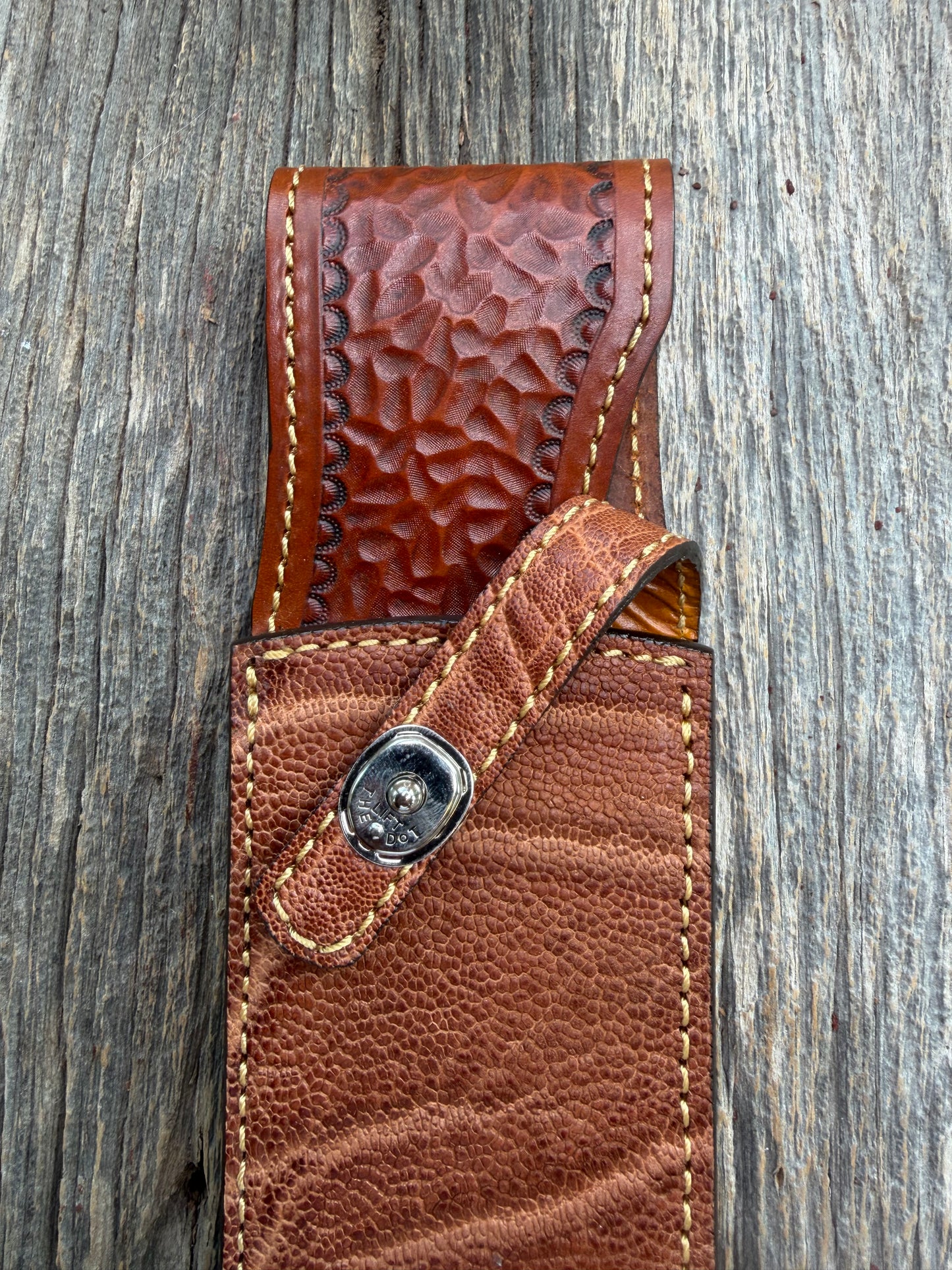 New Randall Model 12-11 Smithsonian Sheath in Exotic thick and textured Rust colored Elephant hide on brown leather from Treeman with a silver Canteen snap. Hand tooled belt loop. Killer sheath.