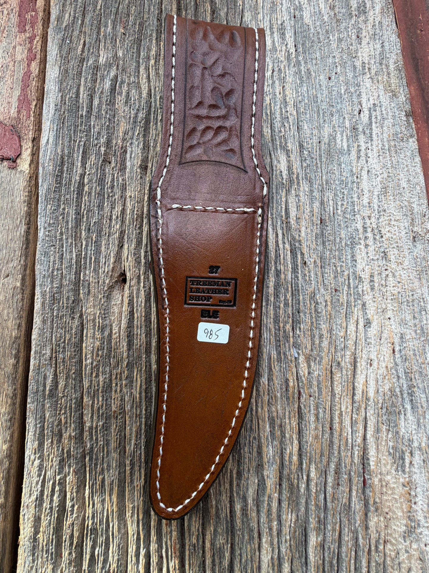 New Randall Model 27 Sheath in Exotic thick and textured Black and Grey Elephant Ear  on brown leather from Treeman with a black Canteen snap. Hand tooled belt loop. Killer sheath.