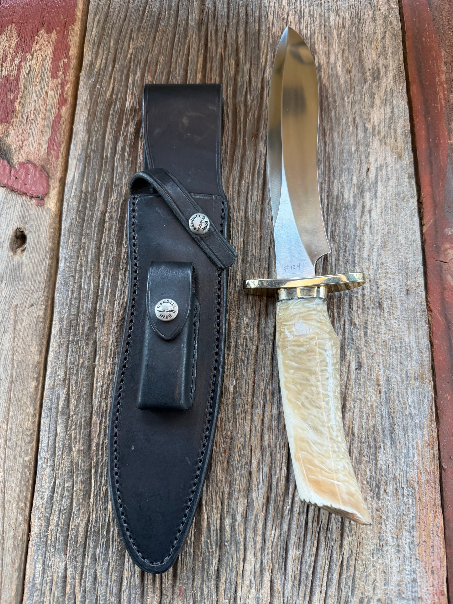 Randall Model 12-8 Small Sasquatch with a nice piece of Musk Ox. Nickel Silver collar and raw natural end.