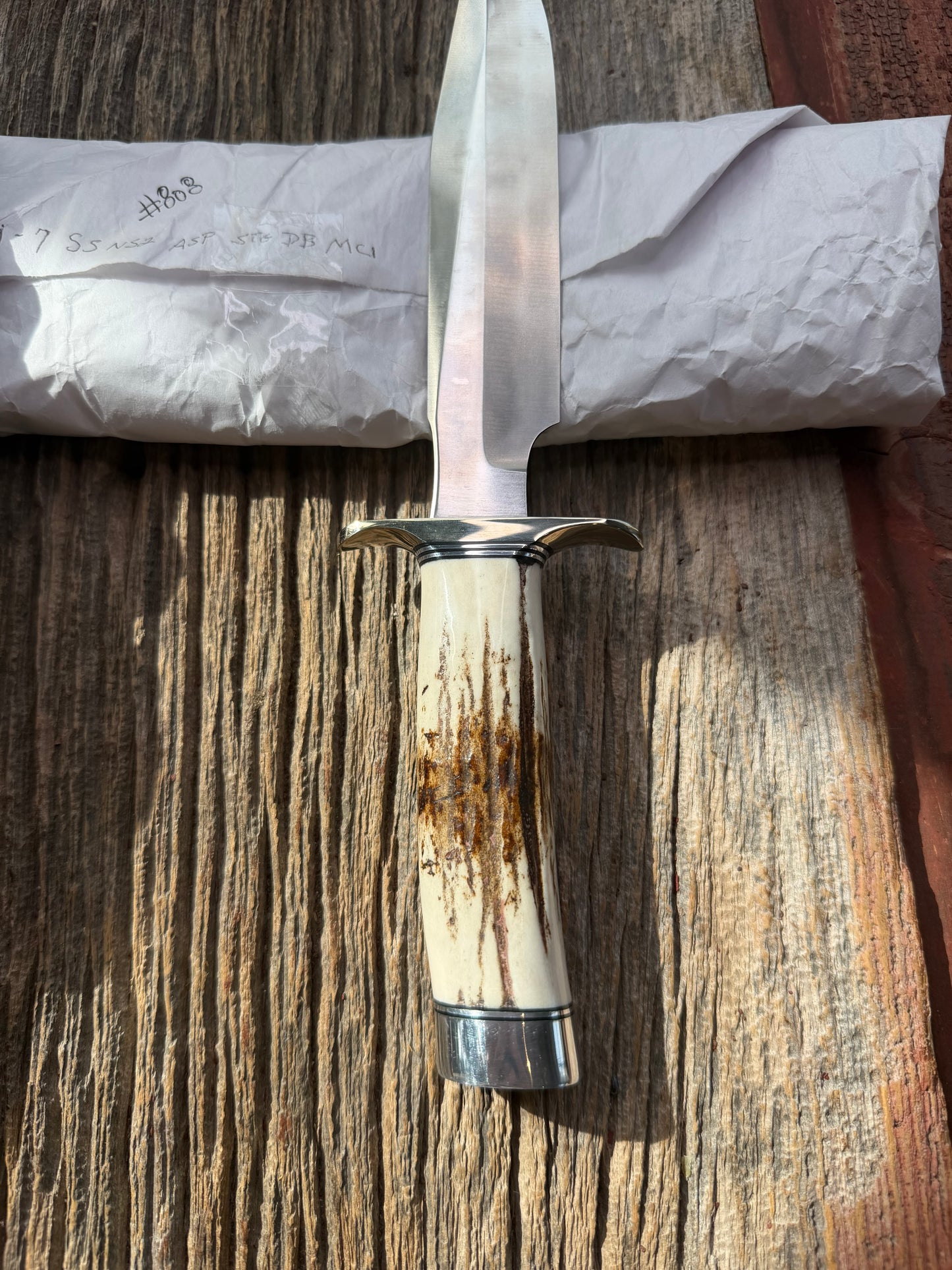 New in Paper Randall Made Knife Model 1-7 Stag , Stainless, Black and Aluminum spacers, Nickel Silver Hilt, Aluminum butt cap.