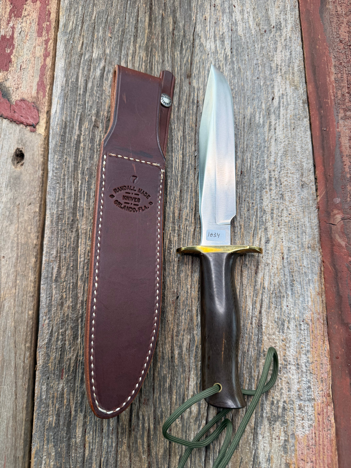 Nice Randall Model 16 SP#1 Special fighter with a Brown Micarta handle. SS blade, brass hilt. Lanyard. Brown leather sheath.