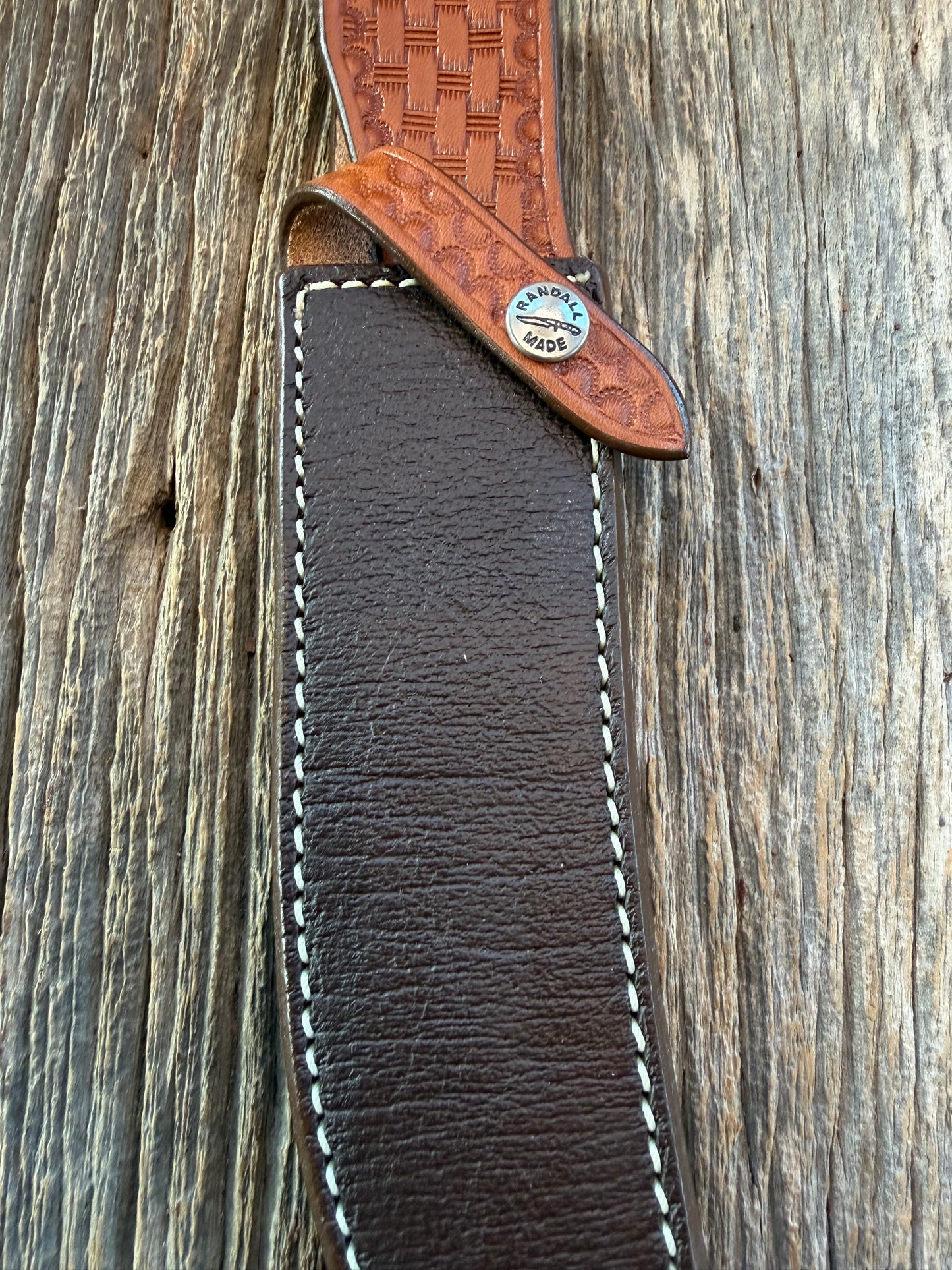 New Randall Model 4-7 Sheath in Exotic Brown Cape Buffalo with full leather hand tooled belt loop. Randall snap and stamp on the back. Custom Made at Sullivan’s by Gutcher