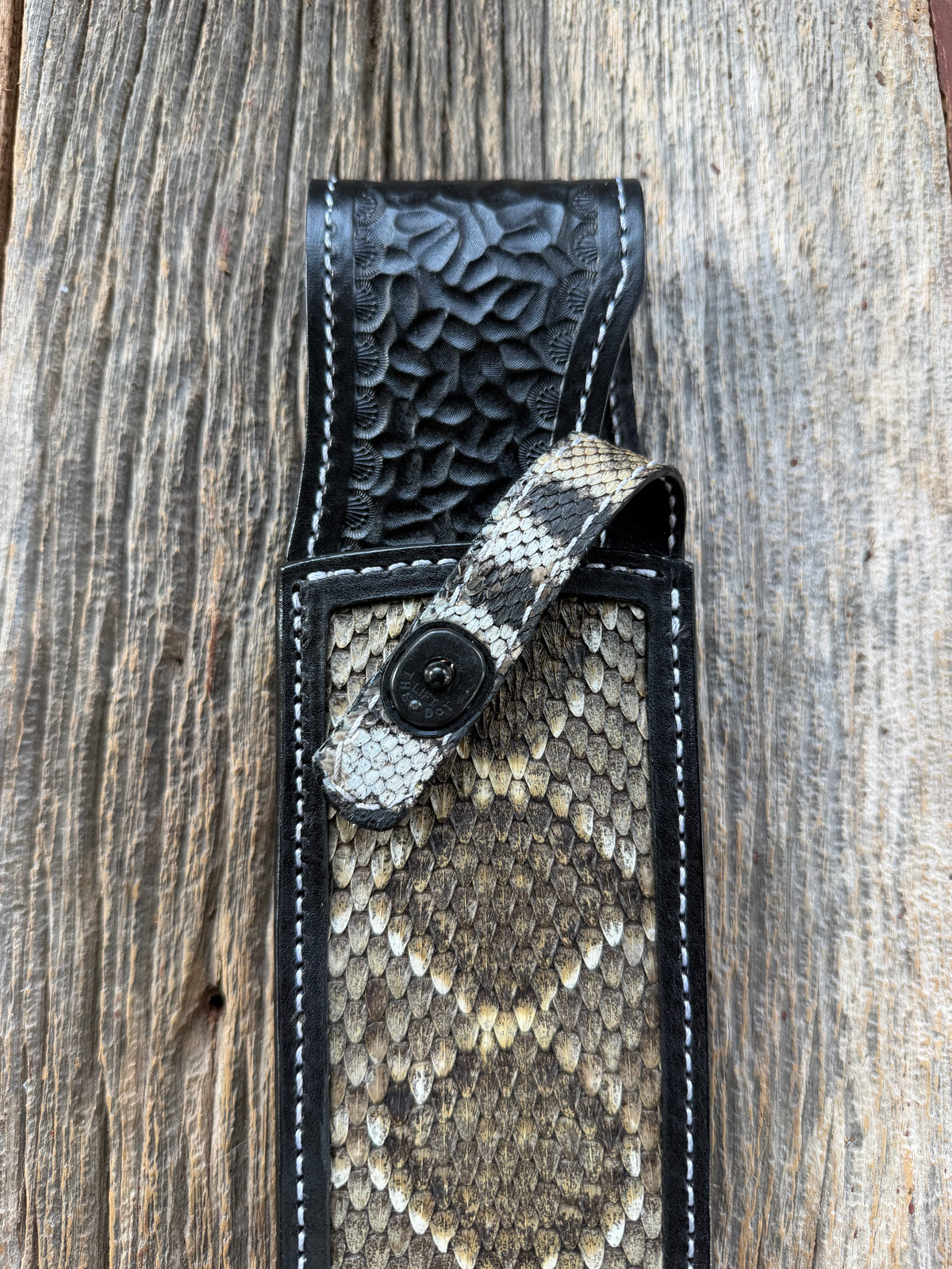 Randall Model Smithsonian sheath with a Western Diamondback RattleSnake skin inlay from Treeman Sheaths. Very dark skin, white thread deviated stitching, black canteen snap.