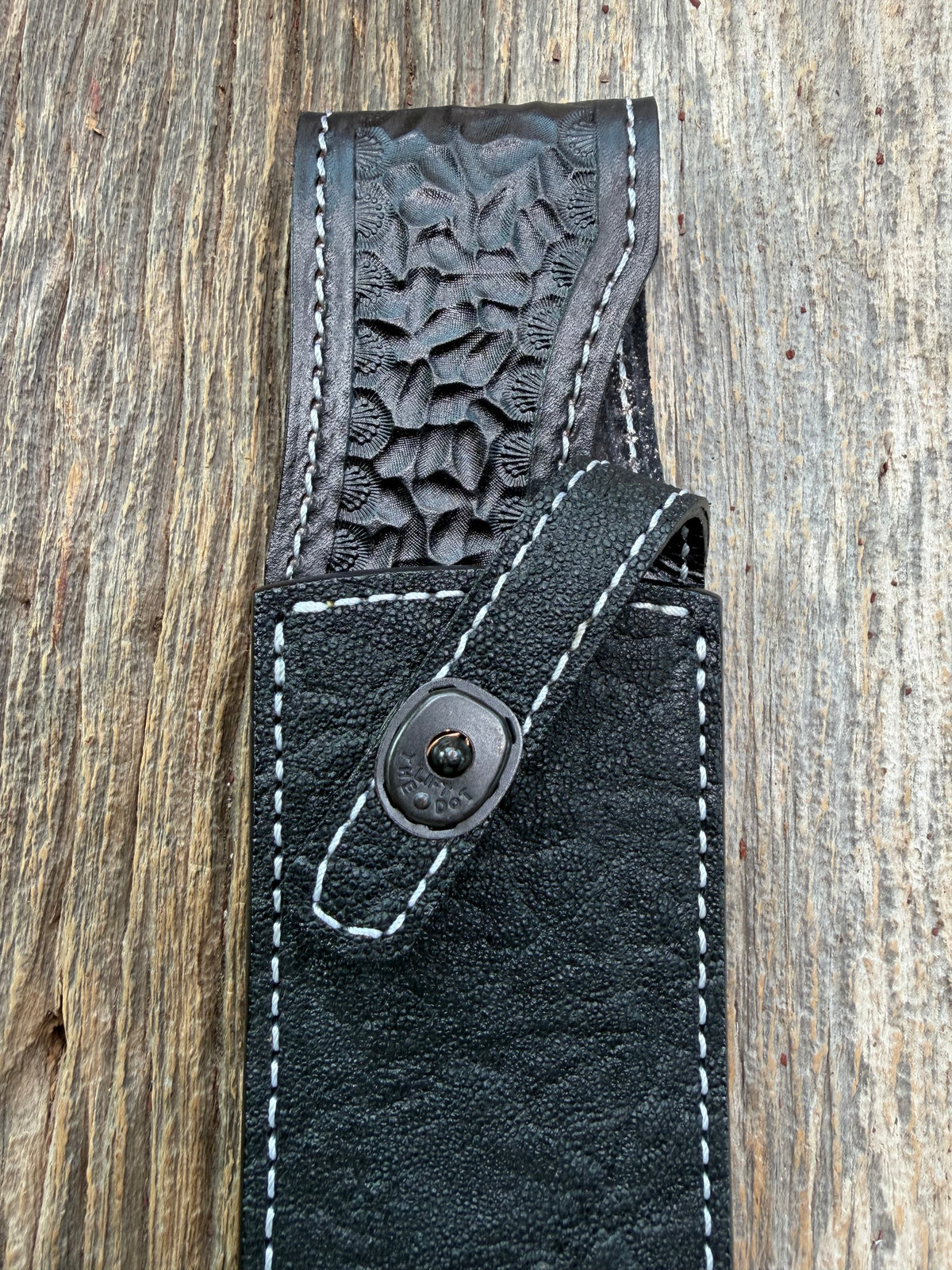 New Randall Model 12-9 Sheath in Exotic Black Matte Elephant Hide from Treeman with a Black Canteen snap. White thread deviated stitching on black leather..Killer sheath.