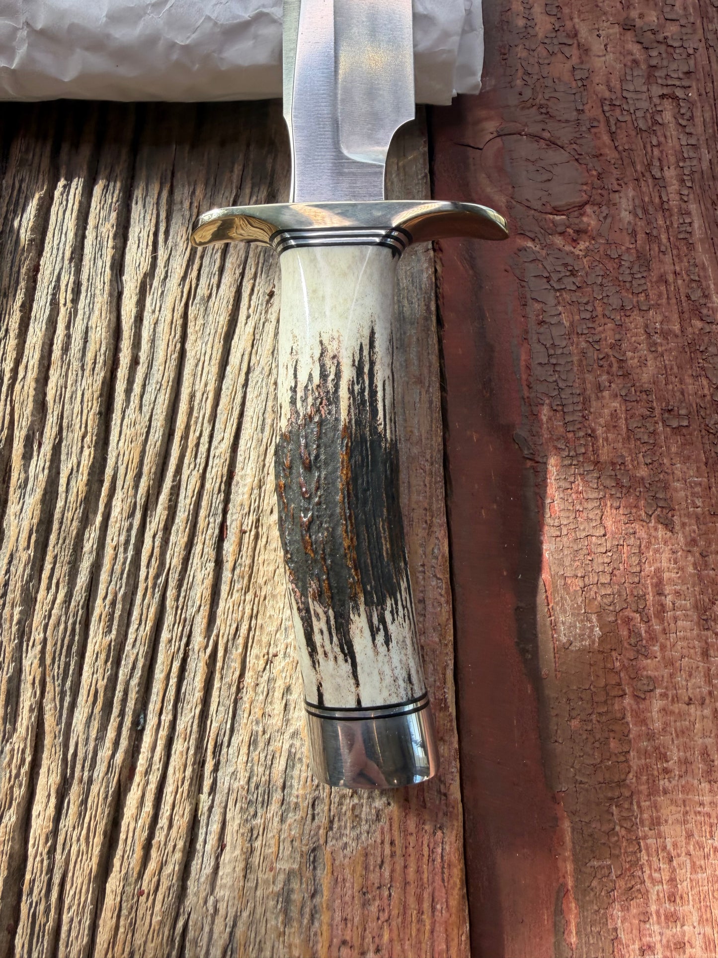 New in paper Randall Model 1-6 with a Stag handle. Stainless steel blade, Nickel silver hilt and Aluminum butt cap. Black and aluminum spacers.