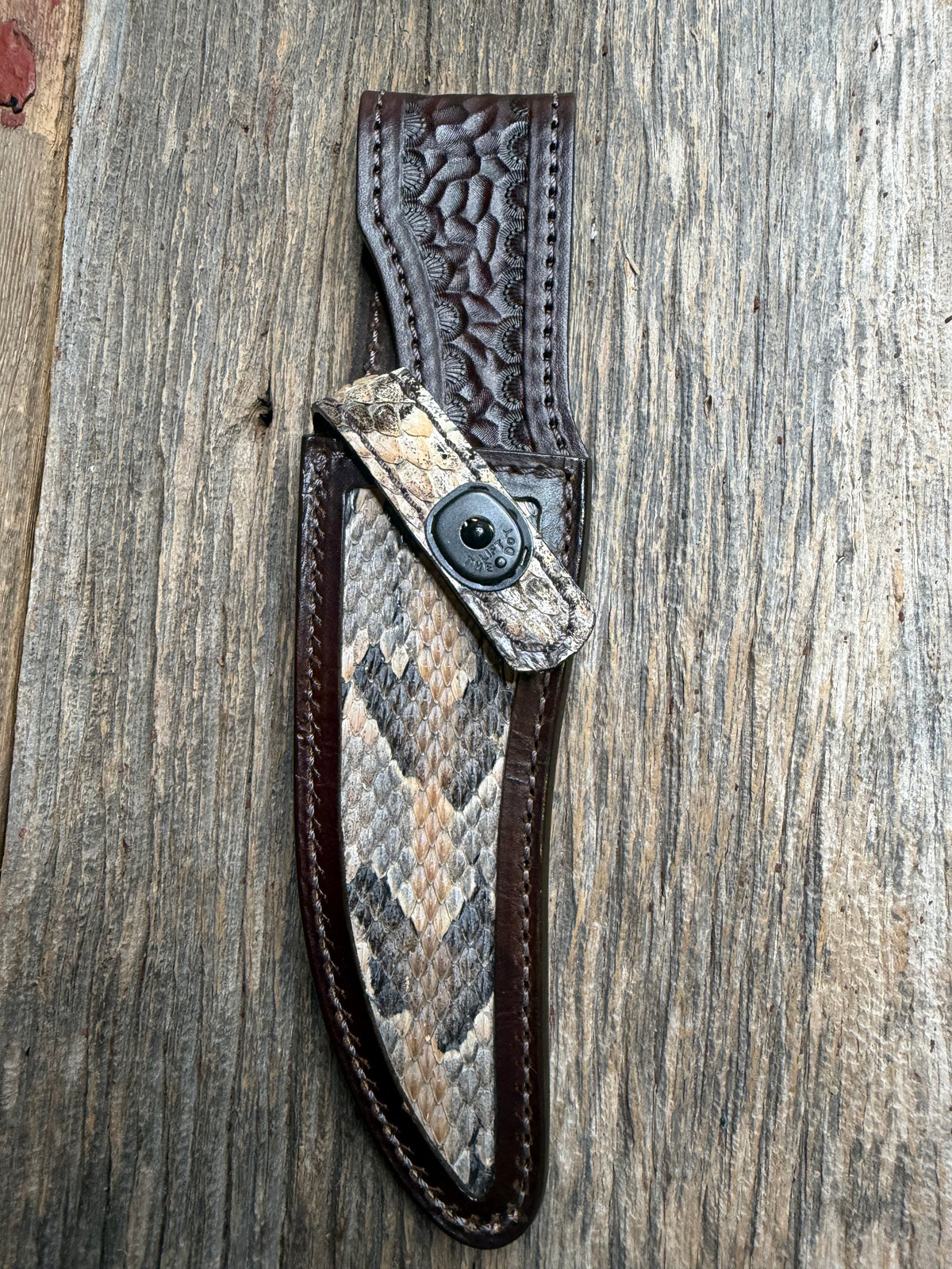 Randall Model 27 sheath with a Canebrake RattleSnake skin from Treeman Sheaths. Vibrant colors and along side Copperheads the hardest skin to source.