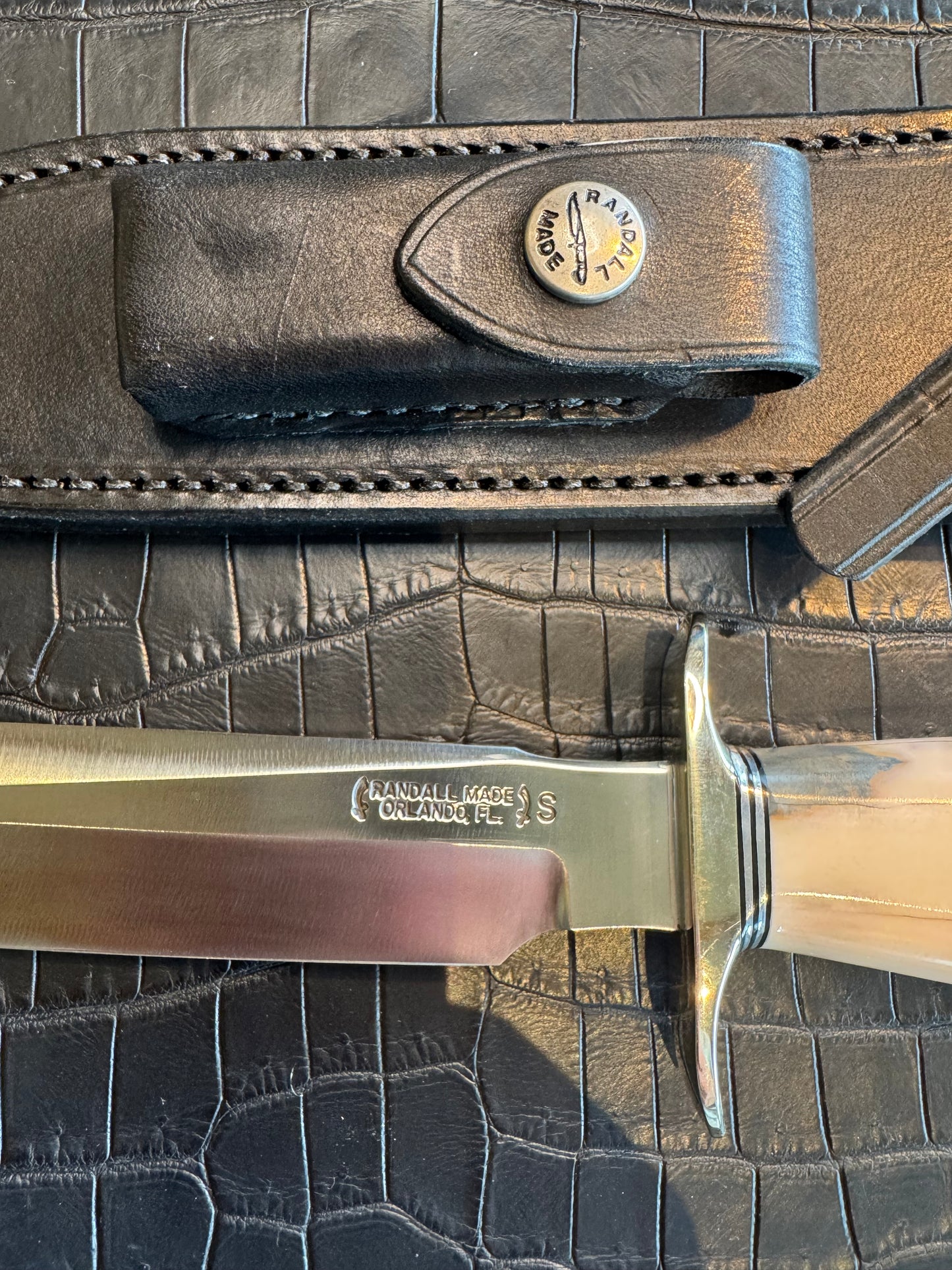 Randall Model 1-7 in Creamy Fossil Walrus Ivory. Nickel Silver Hilt and Aluminum Flanged Butt cap. ( slight crack)