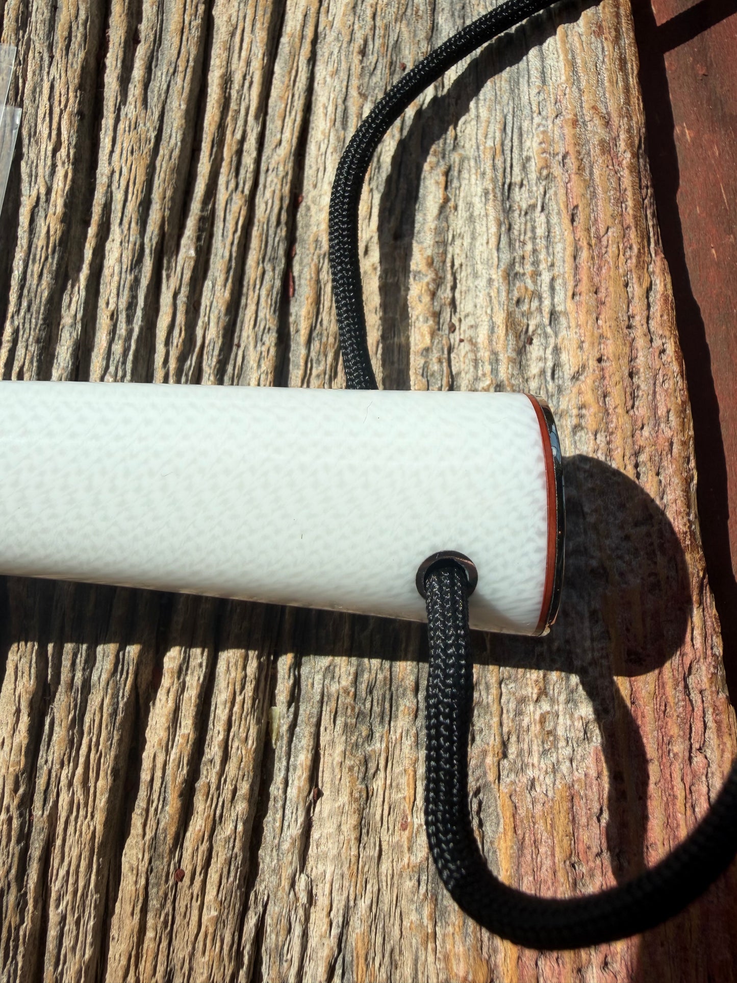 New in Paper Randall Non Catalog Model  Cattleman. White Ivorite handle. Red and silver spacers. Stainless blade.