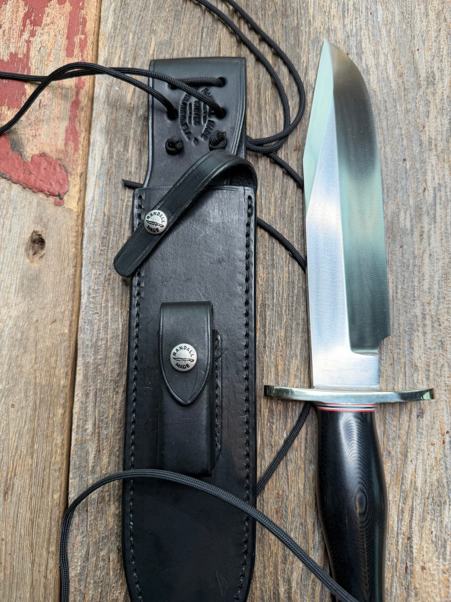 Nice Randall Model 12-9 in black Micarta handle. Red white and Blue spacers, Double Nickel Silver hilt, aluminum butt cap. Stainless blade.