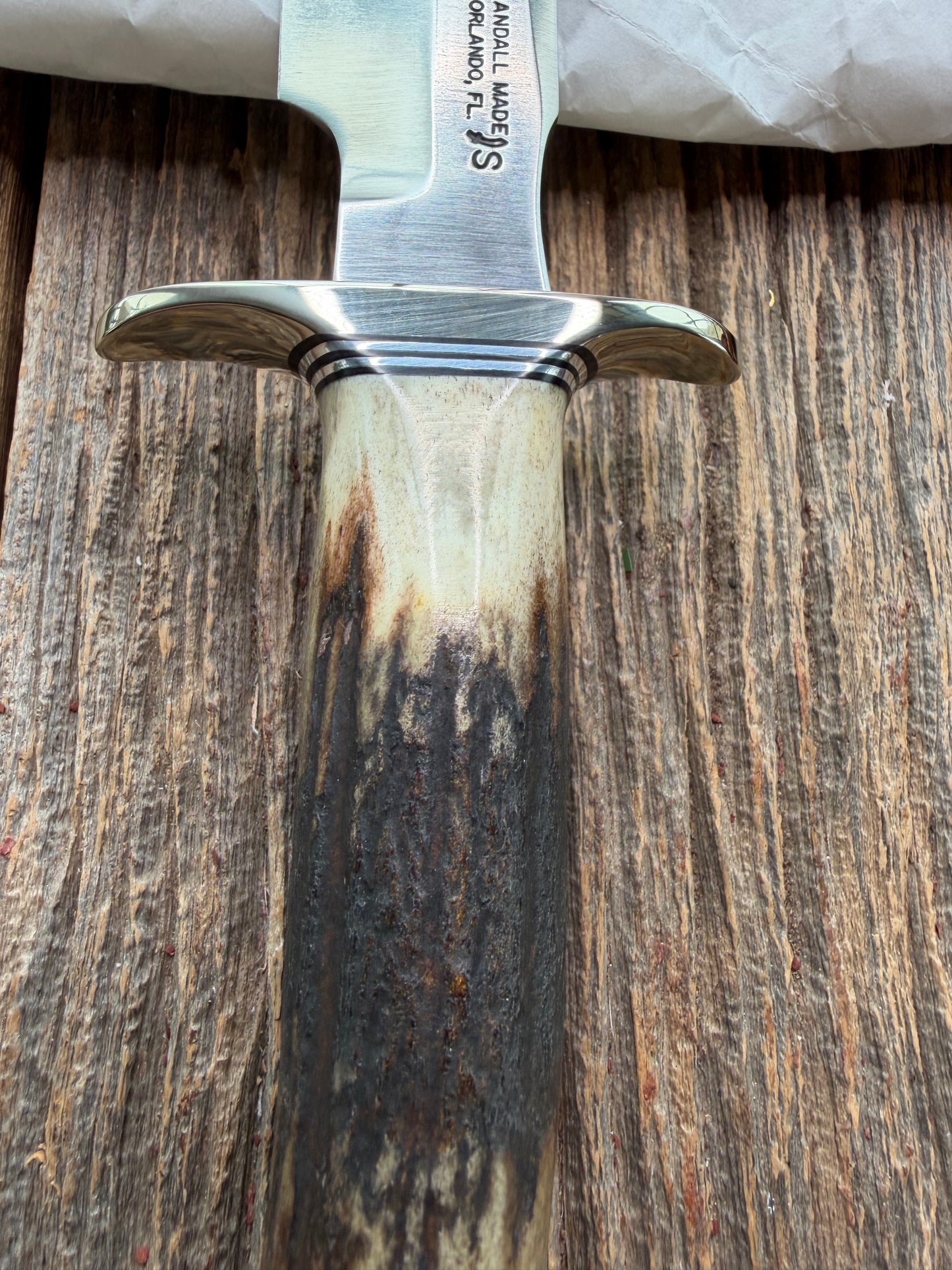 New in Paper Randall Made Knife Model 1-7 Darkened Stag , Stainless, Black and Aluminum spacers, Nickel Silver Hilt, Aluminum butt cap.