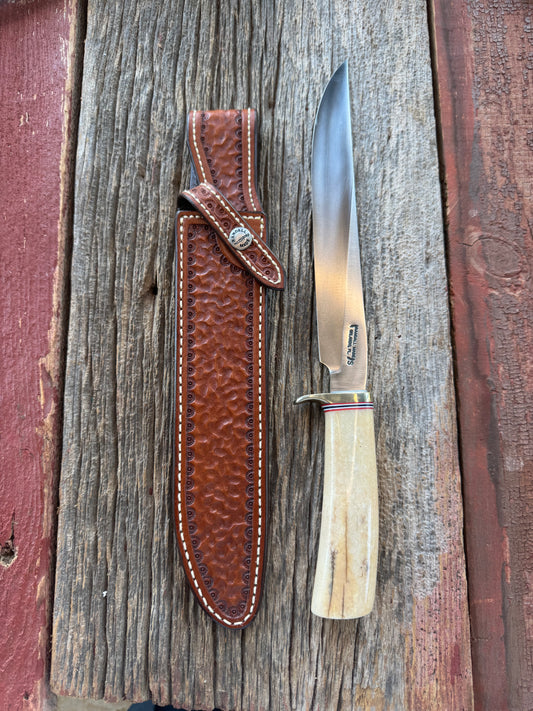 Randall Model 6-9 Filet knife in creamy Fossil Walrus. Extensively hand tooled Gutcher sheath, Nickel Silver Hilt and a natural end.