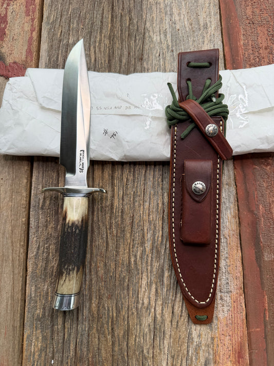 New in Paper Randall Made Knife Model 1-7 Darkened Stag , Stainless, Black and Aluminum spacers, Nickel Silver Hilt, Aluminum butt cap.