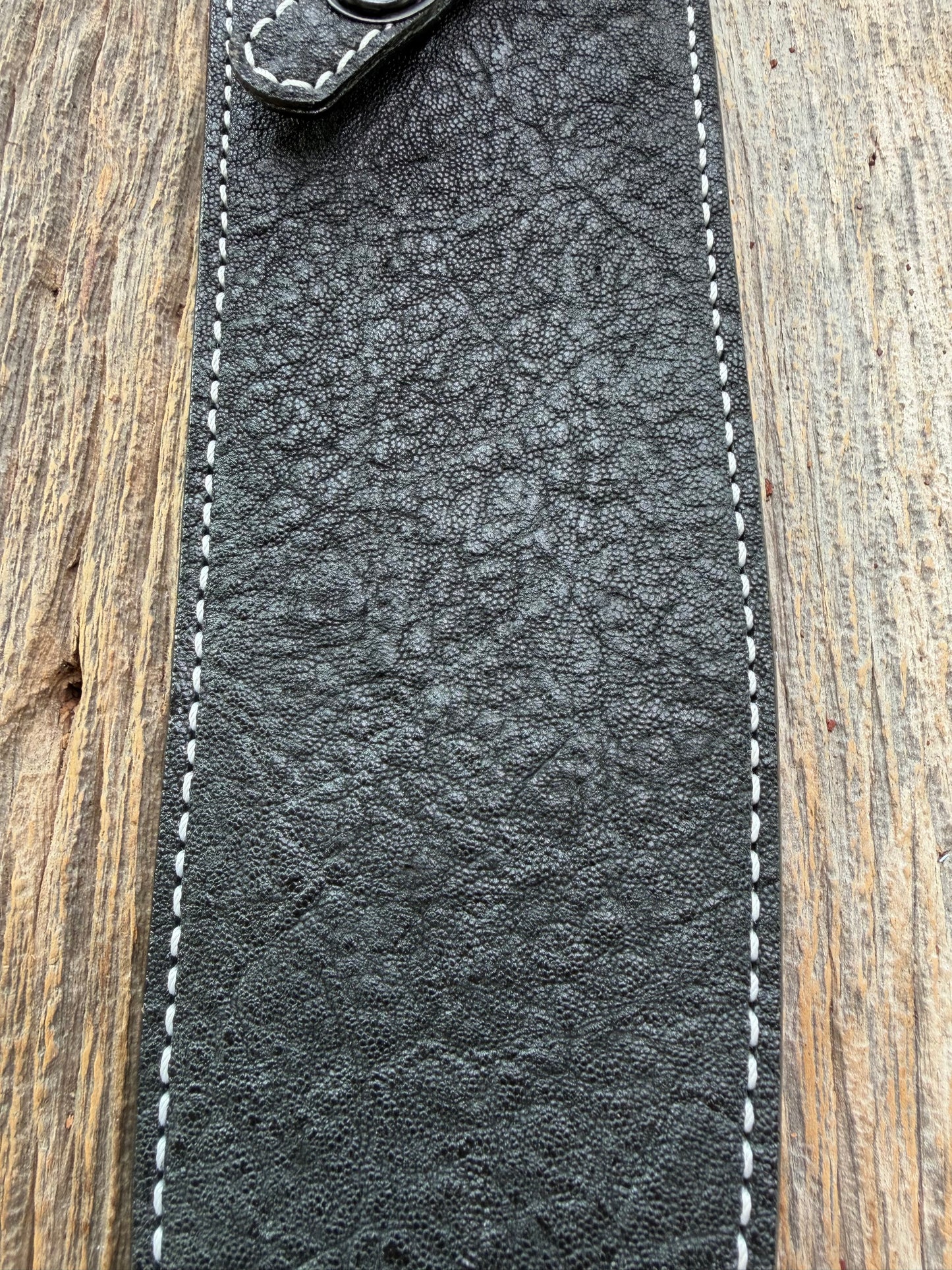 New Randall Model 12-11 Large Sasquatch Sheath in Exotic thick and textured Black Elephant hide on black leather from Treeman with a black Canteen snap. Hand tooled belt loop. Killer sheath.