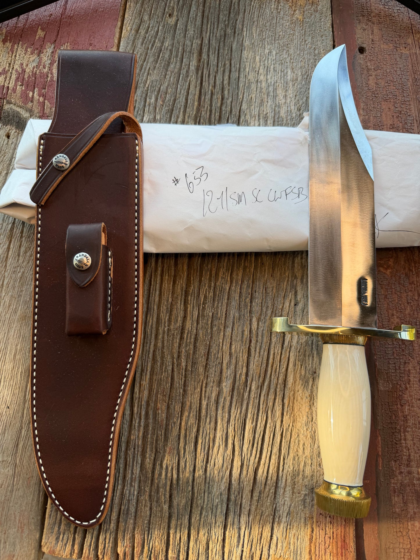 New in Paper Model 12-11 Smithsonian “ Smitty” Beautiful Dave Warthers Resin with a Brass Lugged hilt and Scalloped brass collar and scalloped coolie butt cap.