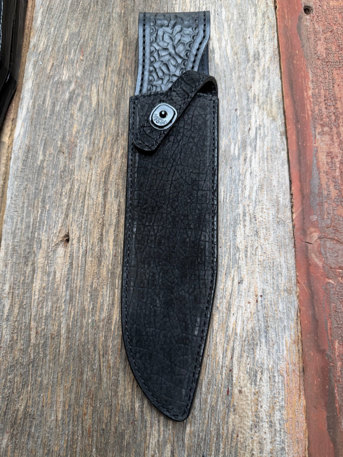 Randall Model 12-9 in Black Hippo, forward curved hilt, black Canteen Snap, full brass stamping and stitching.