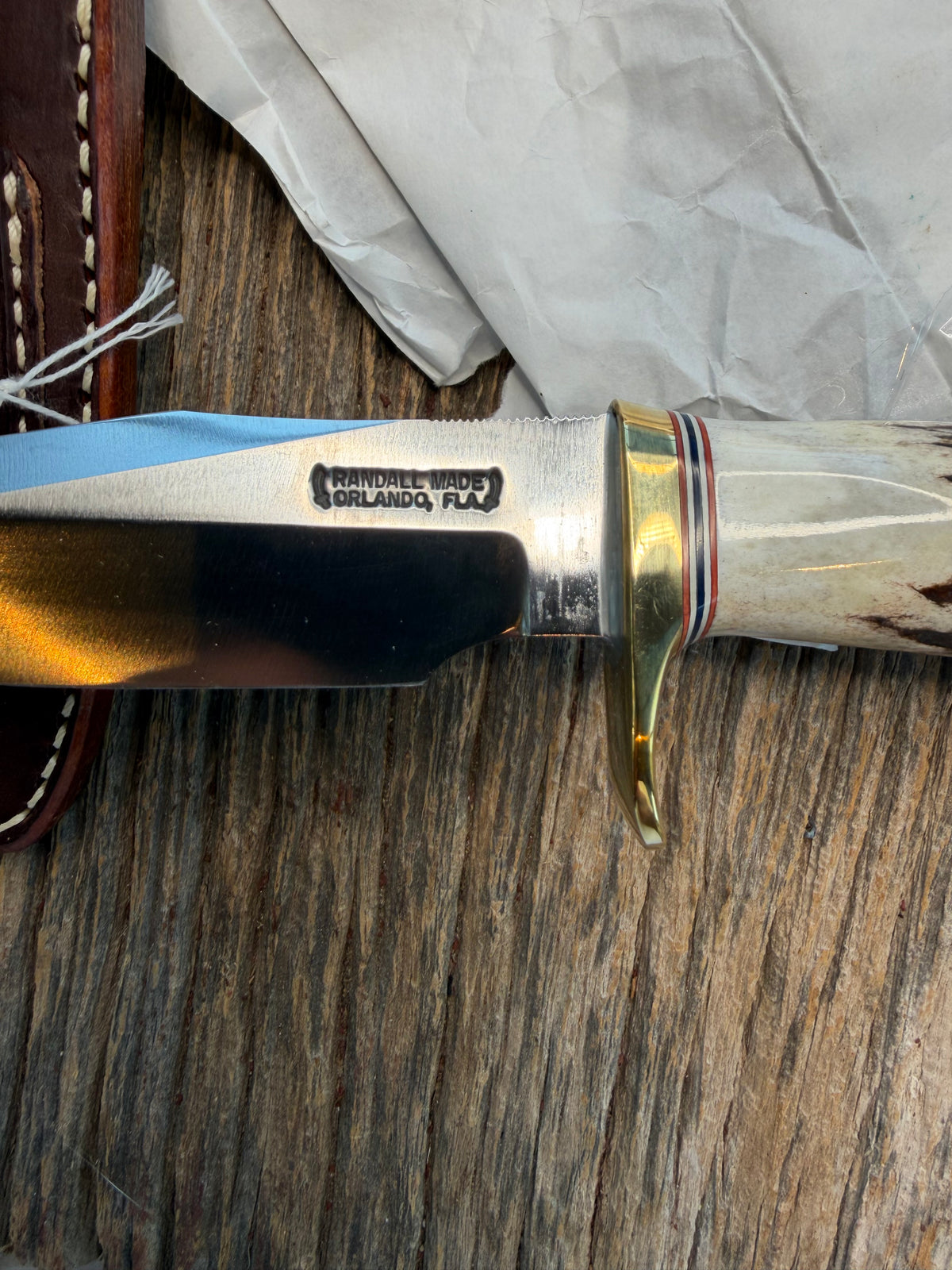 New in paper Randall Model 23 Game Master in Stag with a natural end. Carbon steel blade, Brass Single hilt and Brown leather sheath.