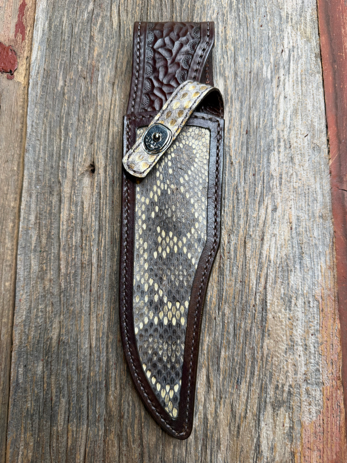 Randall Model 12-8 sheath with an Eastern Diamondback RattleSnake skin from Treeman Sheaths. Hand tooled belt loop, canteen snap. One of the hardest skins to source.