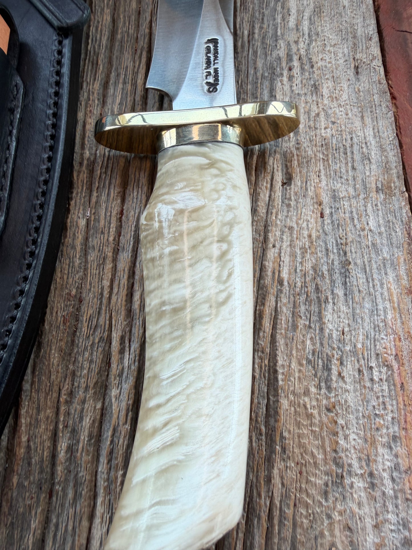 Randall Model 12-8 Small Sasquatch with a nice piece of Musk Ox. Nickel Silver collar and raw natural end.