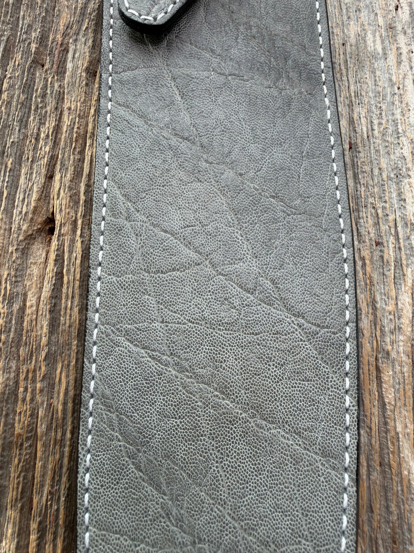 New Randall Model 12-11 Large Sasquatch Sheath in Exotic thick and textured Grey Elephant Hide on black leather from Treeman with a silver Canteen snap. Hand tooled belt loop. Killer sheath.