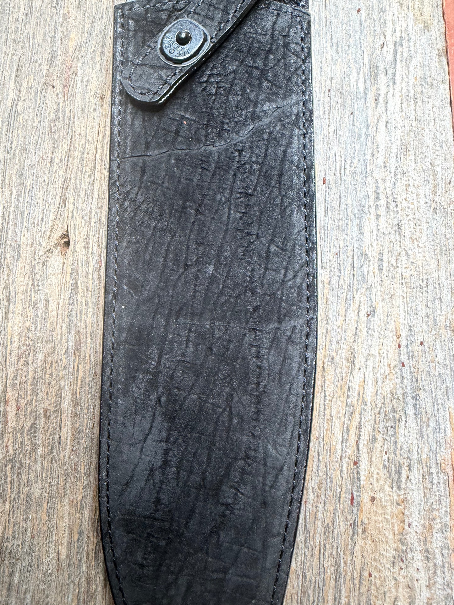 Randall Model 12-11 Large Sasquatch in Black Hippo, forward curved hilt, black Canteen Snap, full brass stamping and stitching.