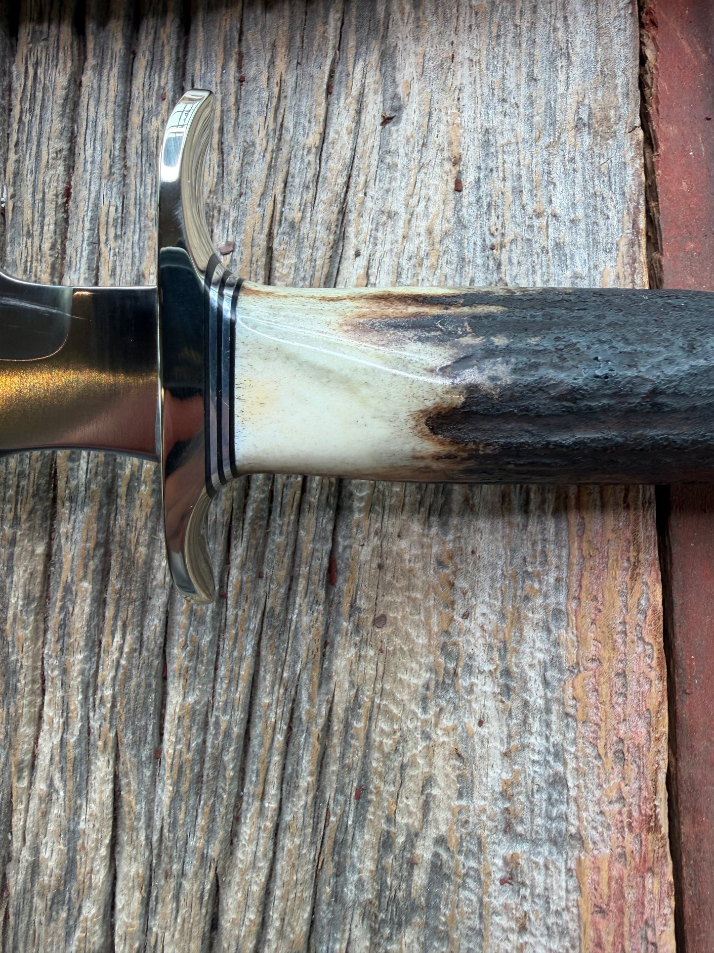 New in Paper Randall Made Knife Model 1-7 Darkened Stag , Stainless, Black and Aluminum spacers, Nickel Silver Hilt, Aluminum butt cap.