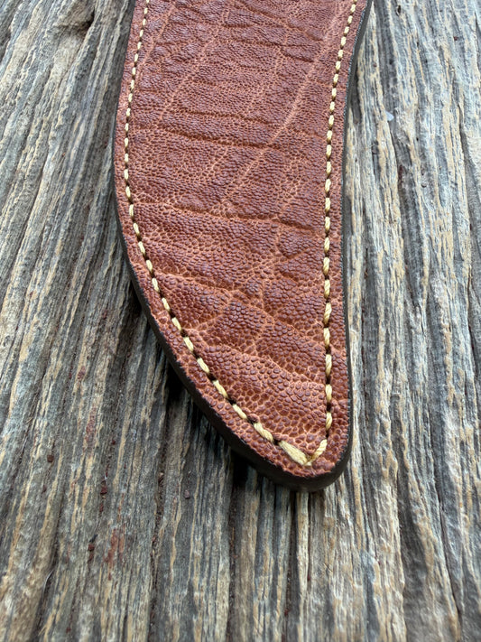 New Randall Model 12-8 Big Bear Sheath in Exotic thick and textured Rust colored Elephant hide on brown leather from Treeman with a silver Canteen snap. Hand tooled belt loop. Killer sheath.