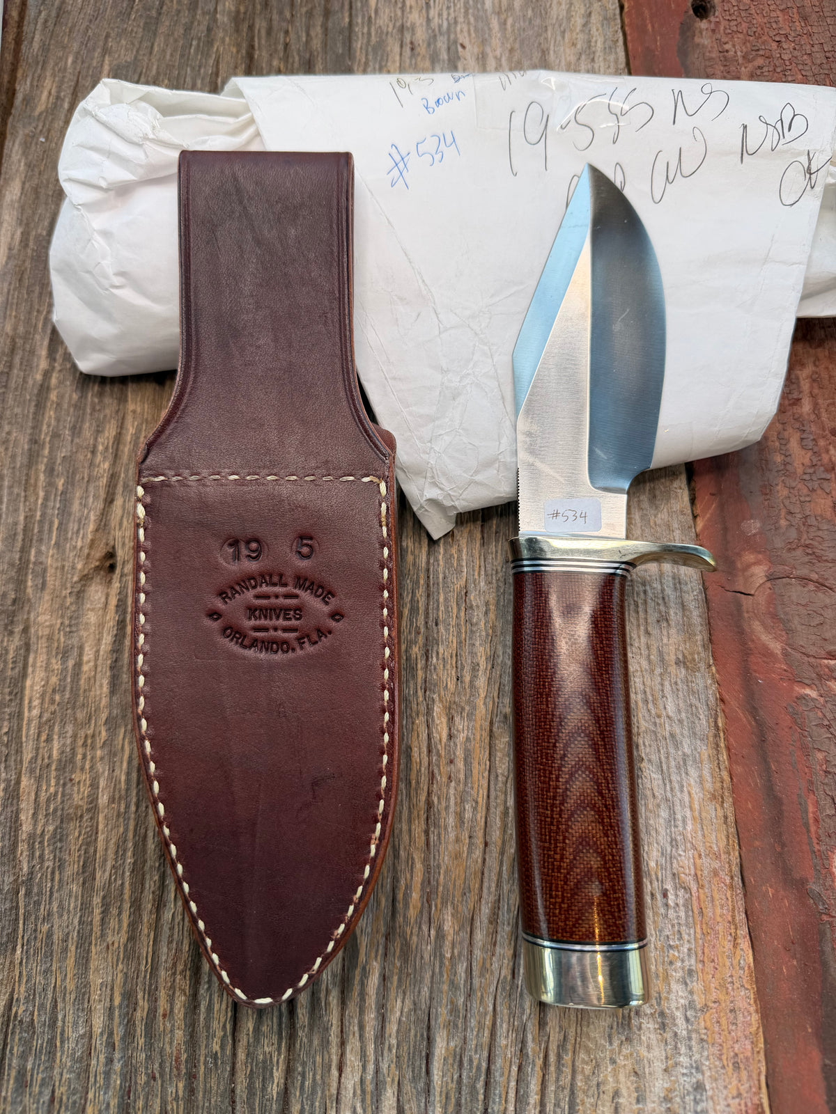 New in Paper Randall Model 19-5 with an attractive piece of Brown Micarta. Nickel silver single Hilt and buttcap , Stainless steel. Black and Aluminum spacers.