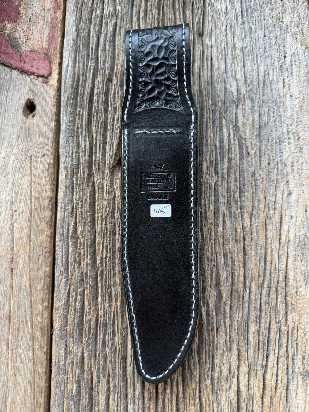 Randall Model 1-7 sheath with inlayed Western Diamondback RattleSnake skin from Treeman Sheaths. Brown leather, white deviated stitching and black canteen snaps.