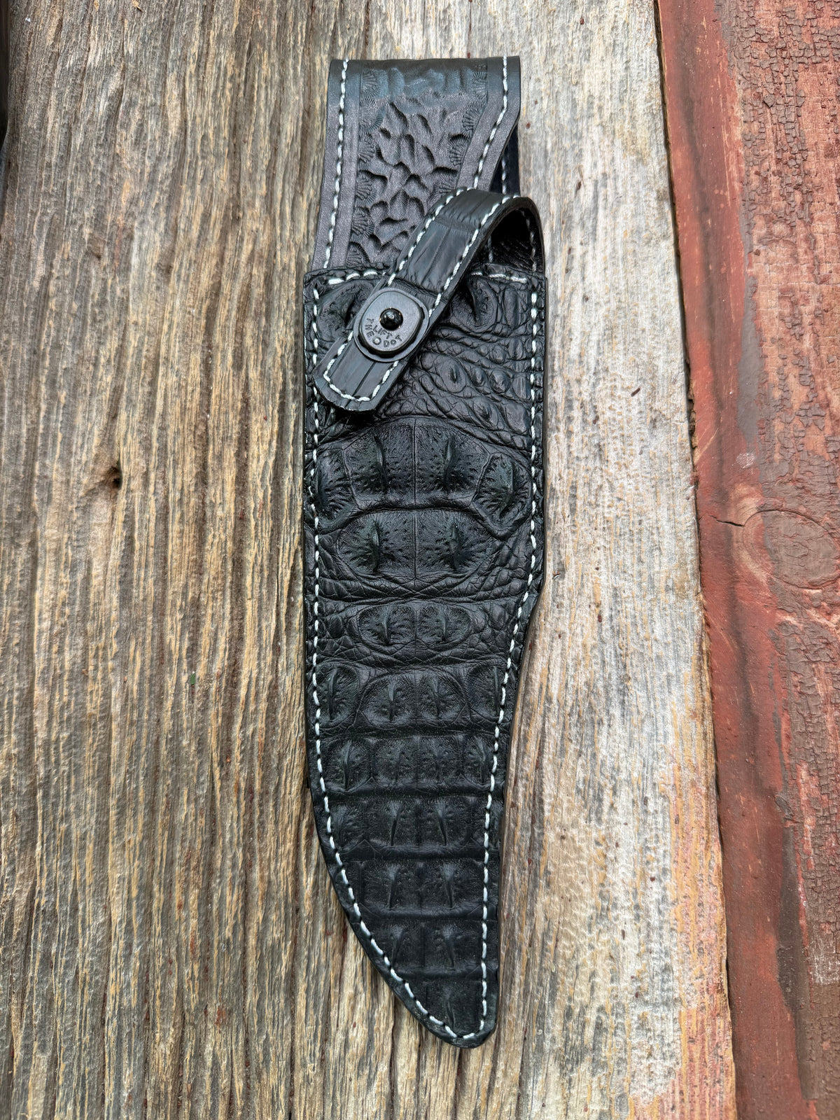 New Randall Model 12-8 Sheath in Exotic Black Matte Crocodile skull from Treeman with a Black Canteen snap. White thread deviated stitching on black leather..Killer sheath.