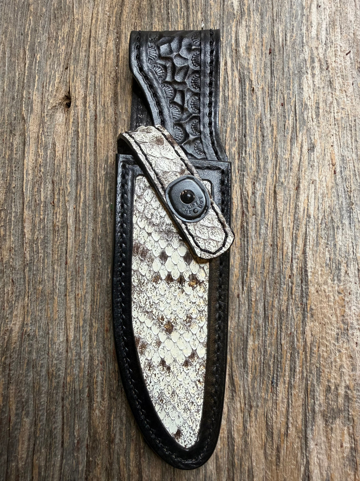 Randall Model Combat Companion sheath with an Eastern Diamondback RattleSnake skin from Treeman Sheaths. Hand tooled belt loop, canteen snap. One the hardest skins to source.