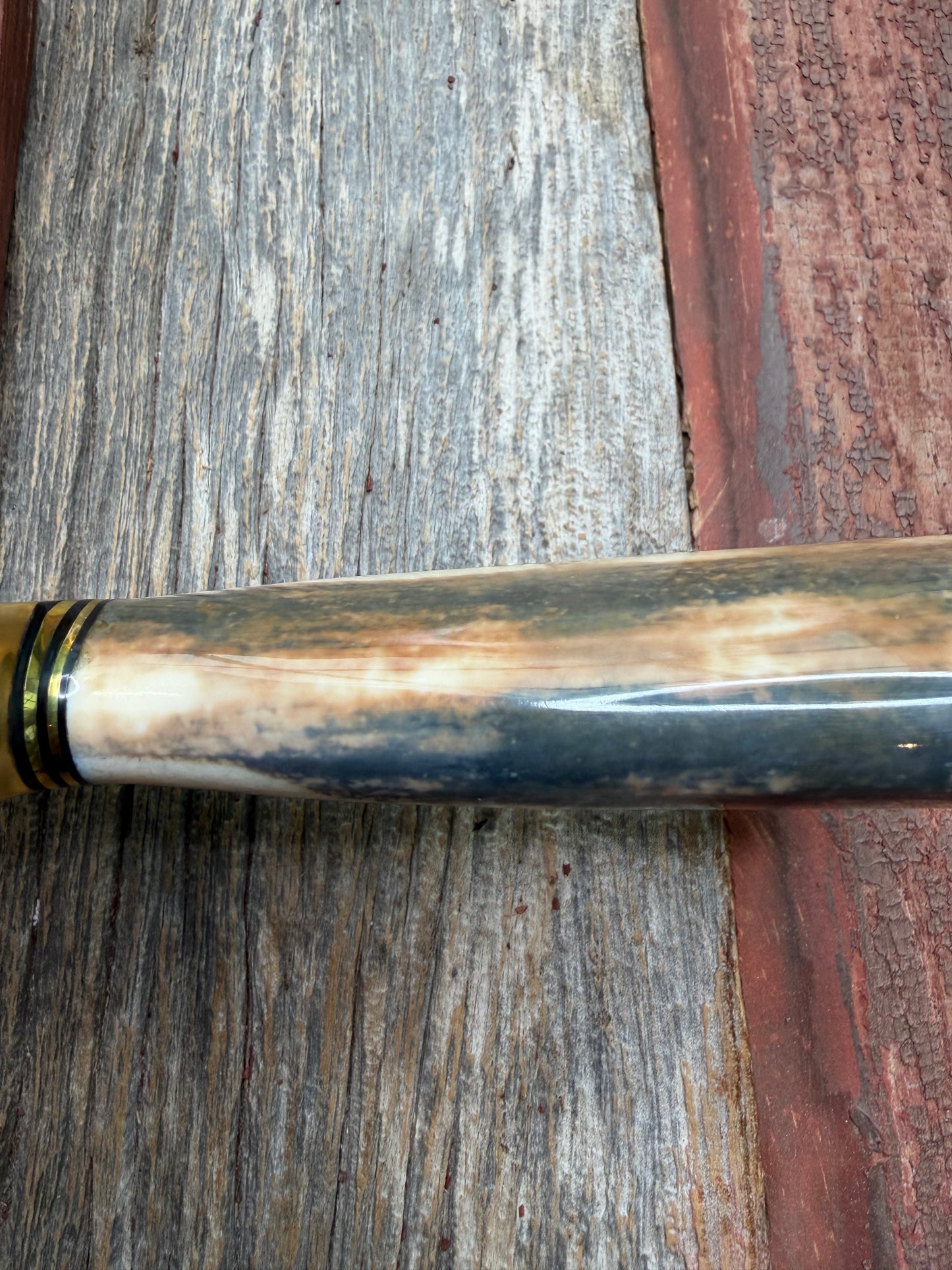 Randall Model 12-11 Smithsonian “Smitty” in a Huge piece of Green, Brown and Blue Fossil Walrus Ivory. Brass Hilt and Brass Butt plate fully engraved in Silver from Jere Davidson.  Stunning piece.