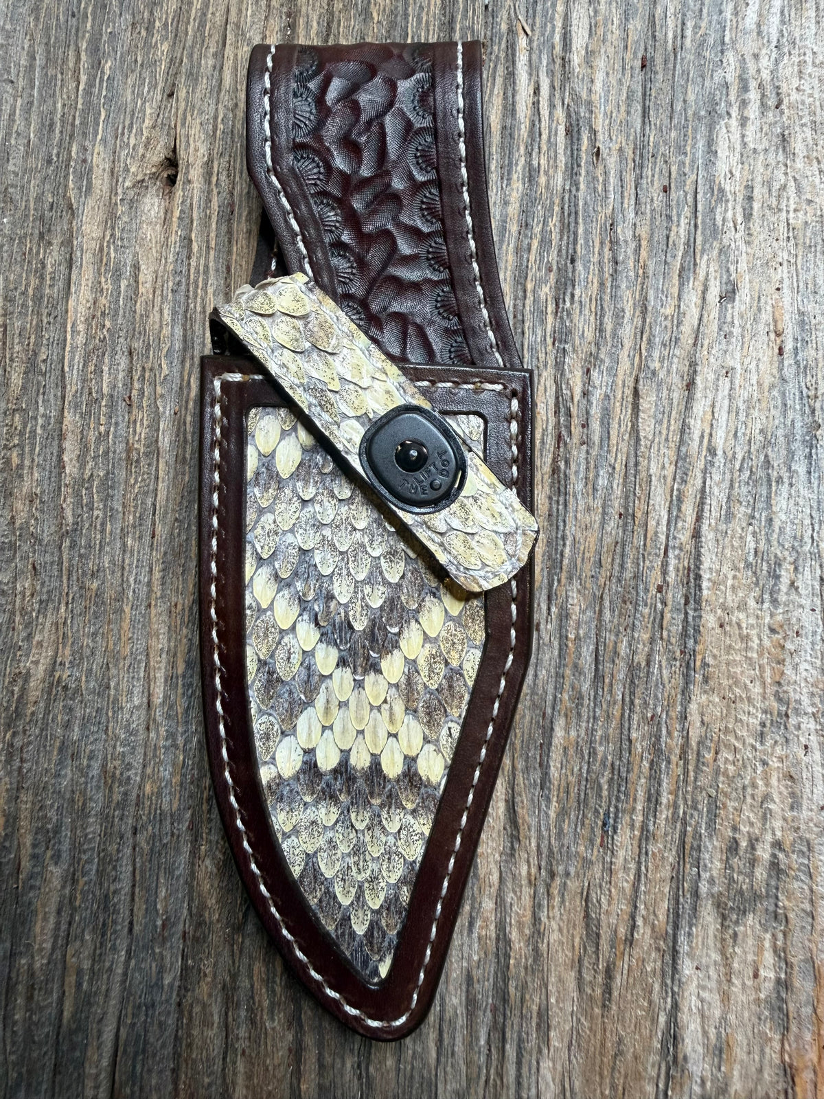 Randall Model 19-5 sheath with an Eastern Diamondback RattleSnake skin from Treeman Sheaths. Hand tooled belt loop, canteen snap. One the hardest skins to source.
