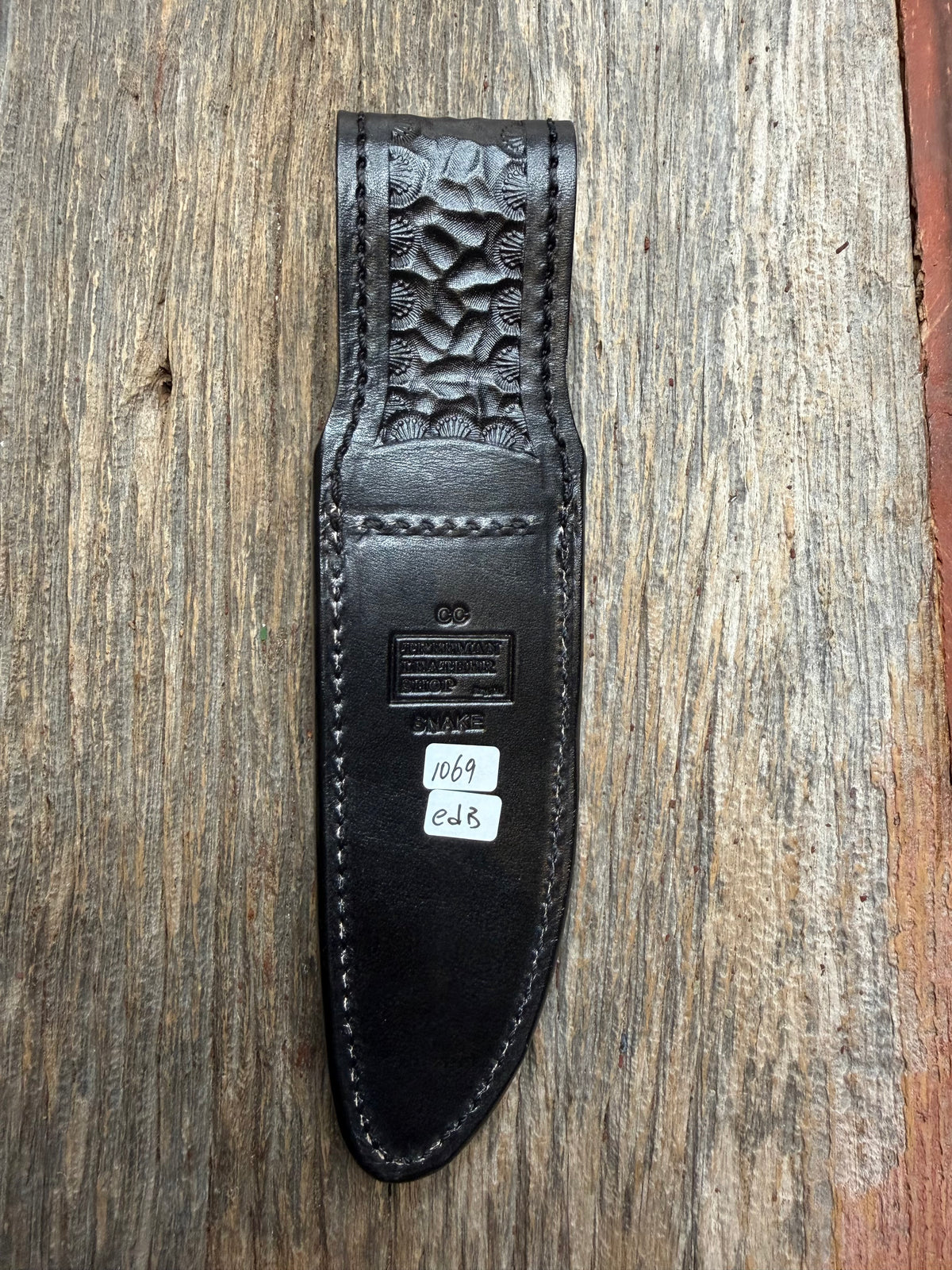Randall Model Combat Companion sheath with an Eastern Diamondback RattleSnake skin from Treeman Sheaths. Hand tooled belt loop, canteen snap. One the hardest skins to source.