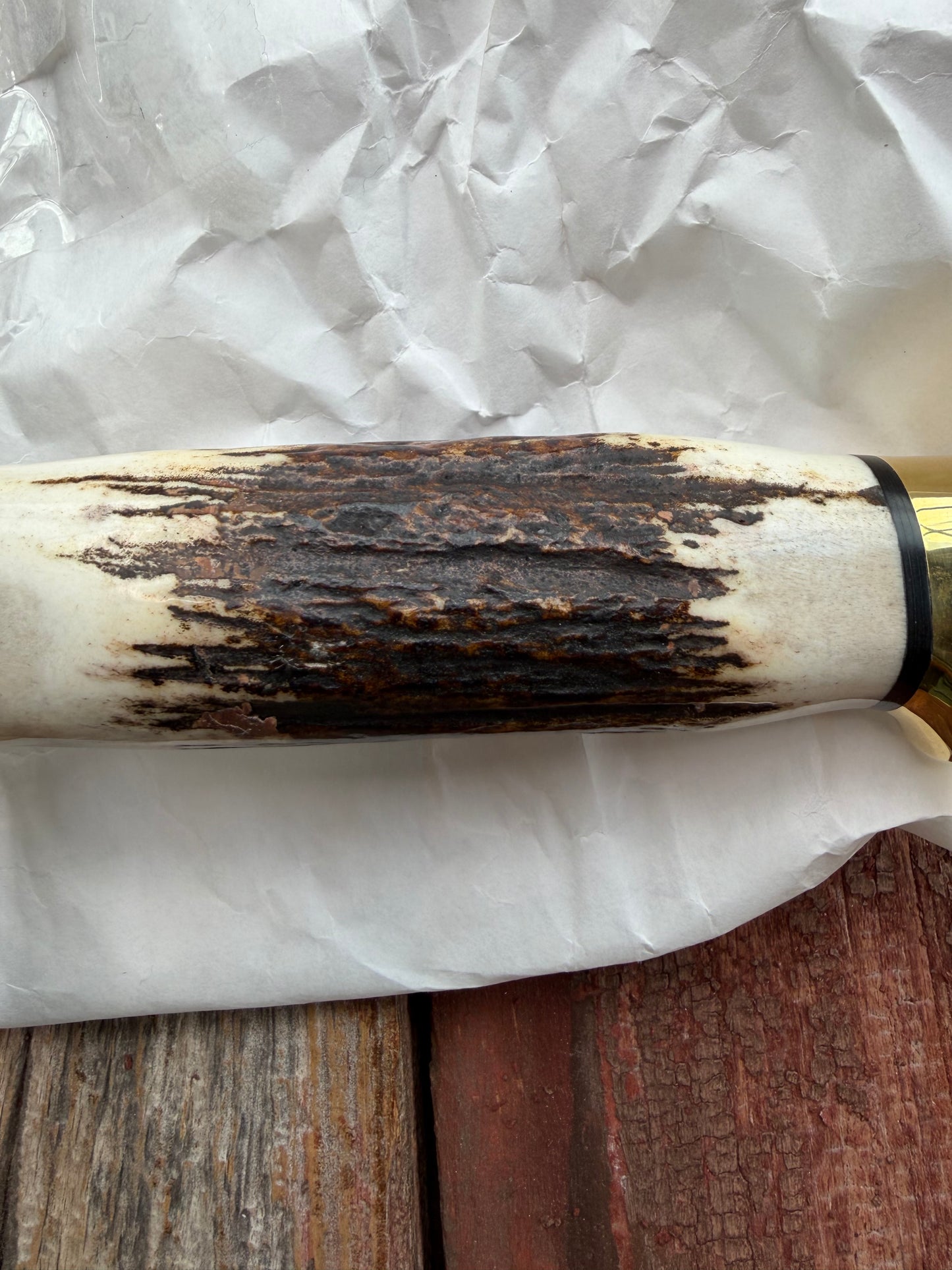 New in paper fresh from the Shop. Randall Knife Model 14-7.5 Big. Nice piece of Stag, Gorgeous Brass Lugged hilt and brass crows beak butt cap. Single black spacer. Stainless steel.