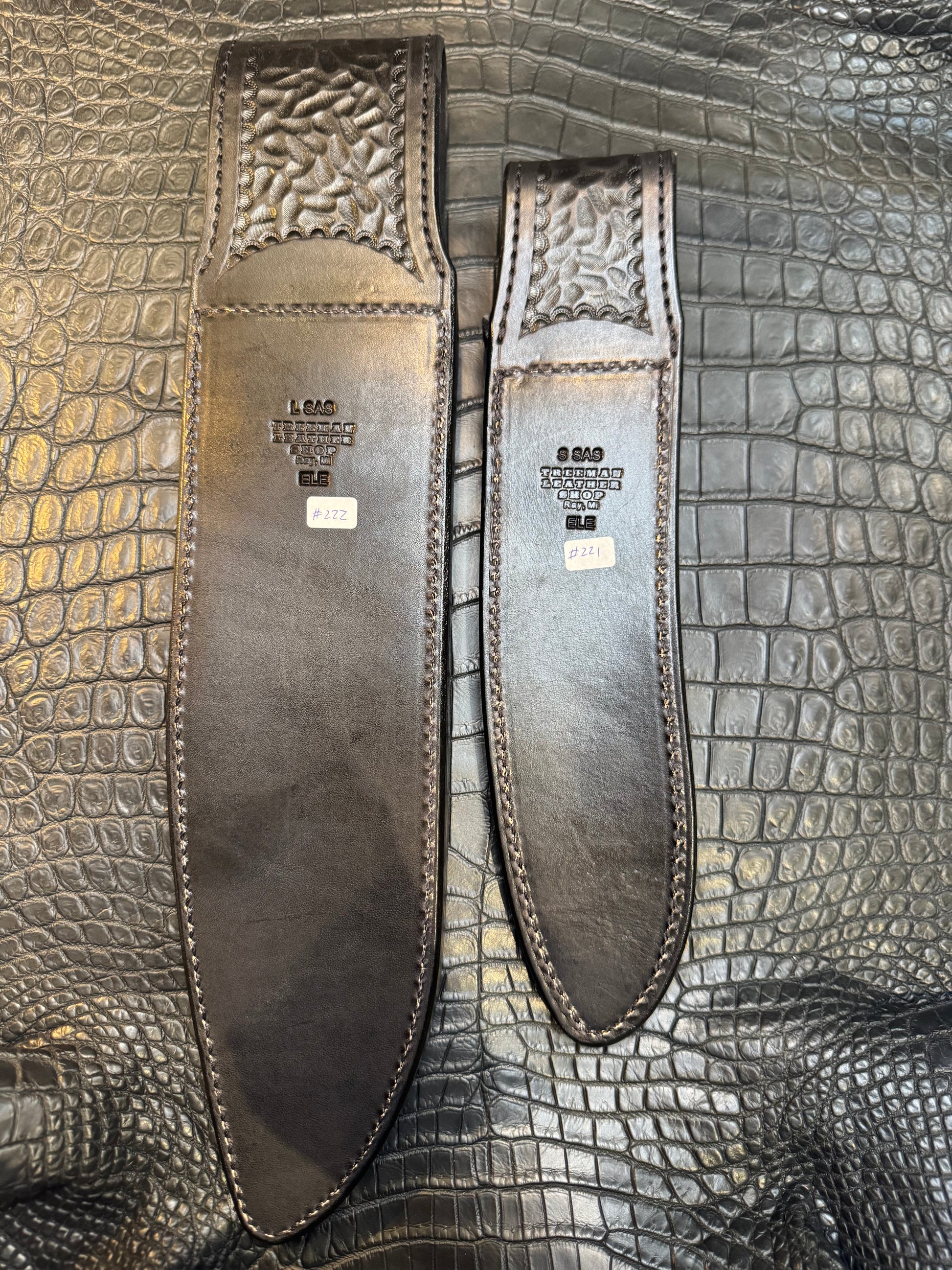 A pair of Randall Model 12-11 Large Sasquatch and Randall Model 12-8 Small Sasquatch Sheaths in Exotic Black Elephant by Treeman.