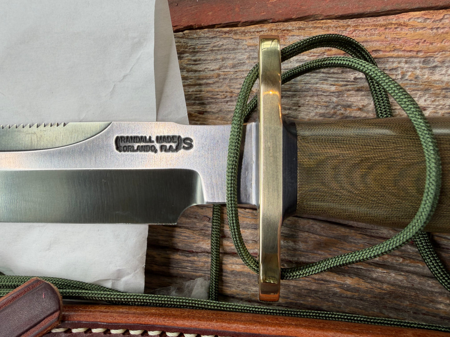 New in Paper Randall Made Knife Model 1-7 Green Micarta handle, Stainless, brass Double Hilt, Brass Crows beak butt cap, lanyard, Sawteeth, single black spacer…loaded!!