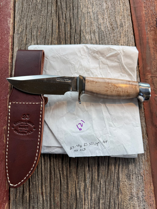 New in Paper Randall Model 23 Game Master Stainless steel blade, Nickel silver hilt and aluminum butt cap. Brown leather sheath. Maple wood handle.