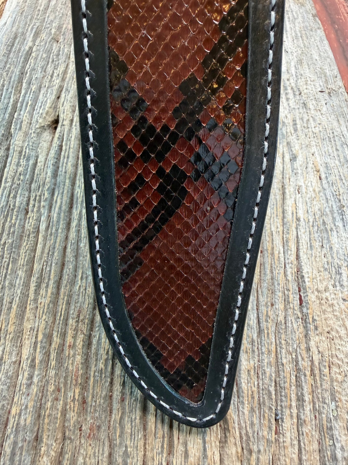 New Randall Model 1-8 Sheath in Exotic Brown Python Snake skin on black leather from Treeman with a black Canteen snap. Hand tooled belt loop. Deviated white stitching. Killer sheath.