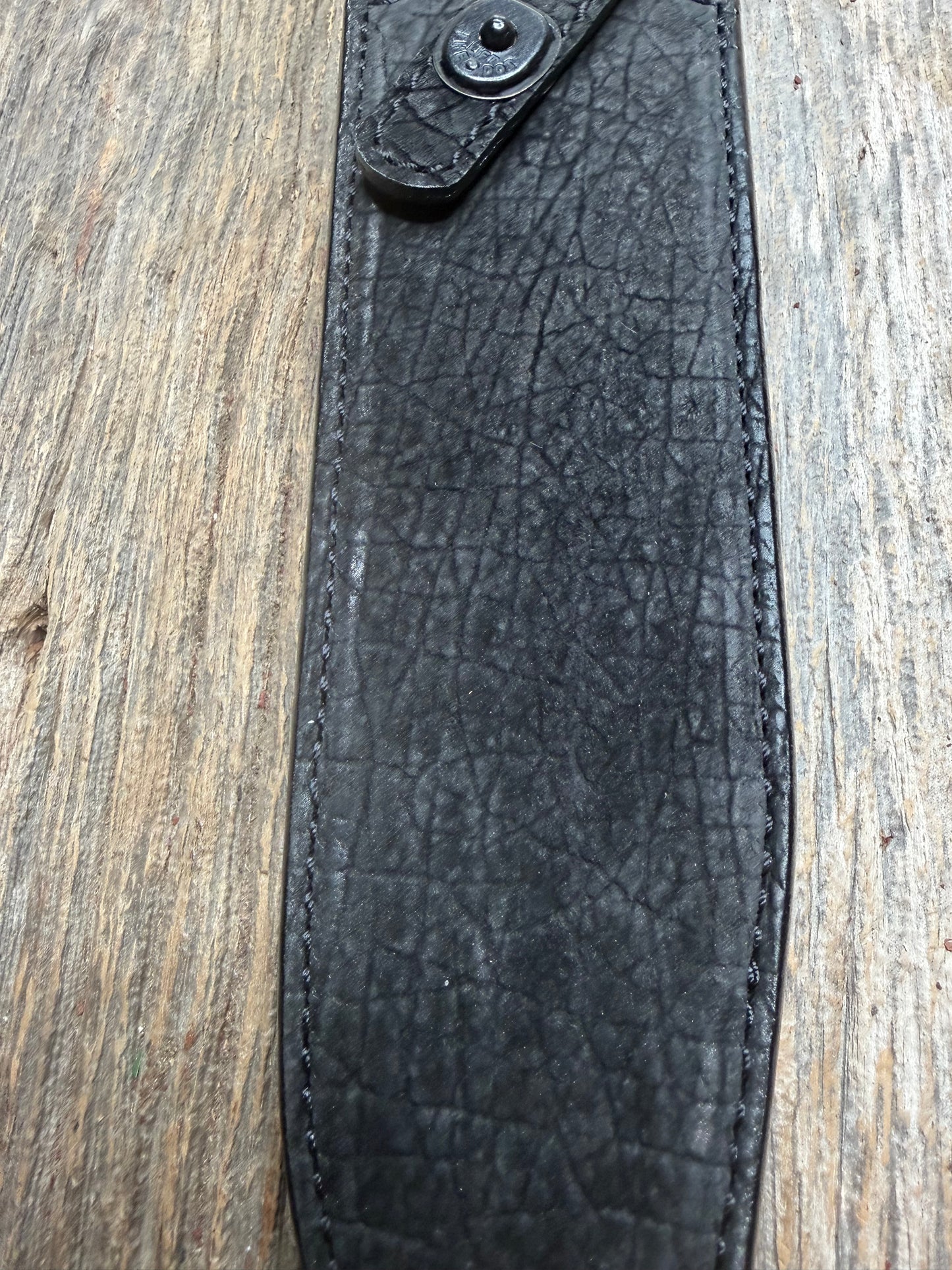 Randall Model 12-9 in Black Hippo, forward curved hilt, black Canteen Snap, full brass stamping and stitching.
