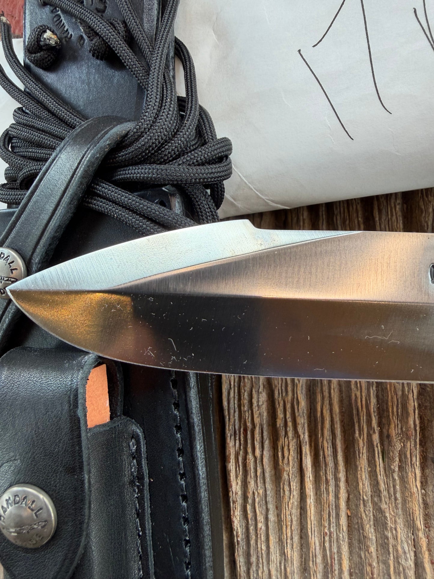 New in Paper Randall Model 17-5.5 Astro knife is a custom, handmade combat knife with a 5.5" stainless steel clip point blade and a brown leather sheath. Full tang design, black handle.