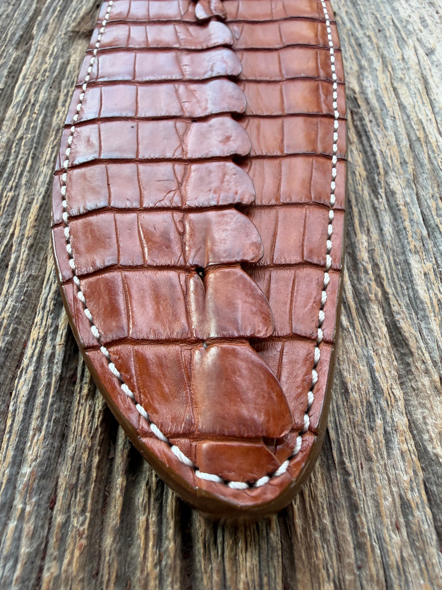 New Randall Model 12-11 Large Sasquatch Sheath in Exotic thick and textured Honey Crocodile skin ( tail portion) on brown leather from Treeman with a silver Canteen snap. Hand tooled belt loop. Killer sheath.