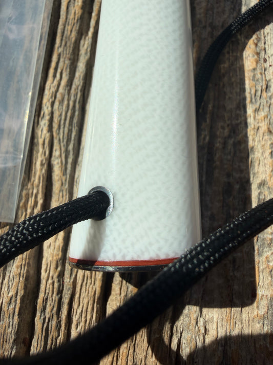 New in Paper Randall Non Catalog Model  Cattleman. White Ivorite handle. Red and silver spacers. Stainless blade.