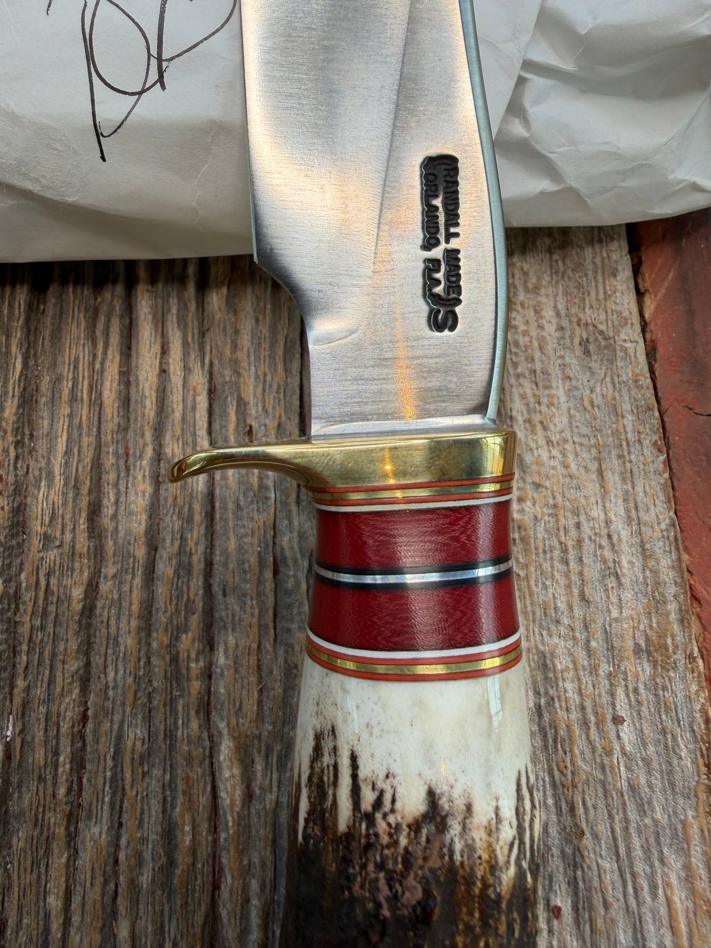 New in Paper Randall Made Knife Model 27-5 with a Stag handle, Stainless, brass single Hilt, red and aluminum spacers, loaded!!