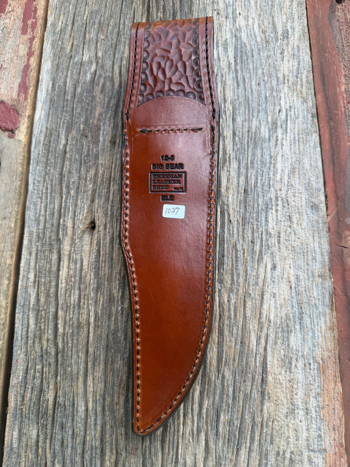 New Randall Model 12-8 Big Bear Sheath in Exotic thick and textured Rust colored Elephant hide on brown leather from Treeman with a black Canteen snap. Hand tooled belt loop. Killer sheath.