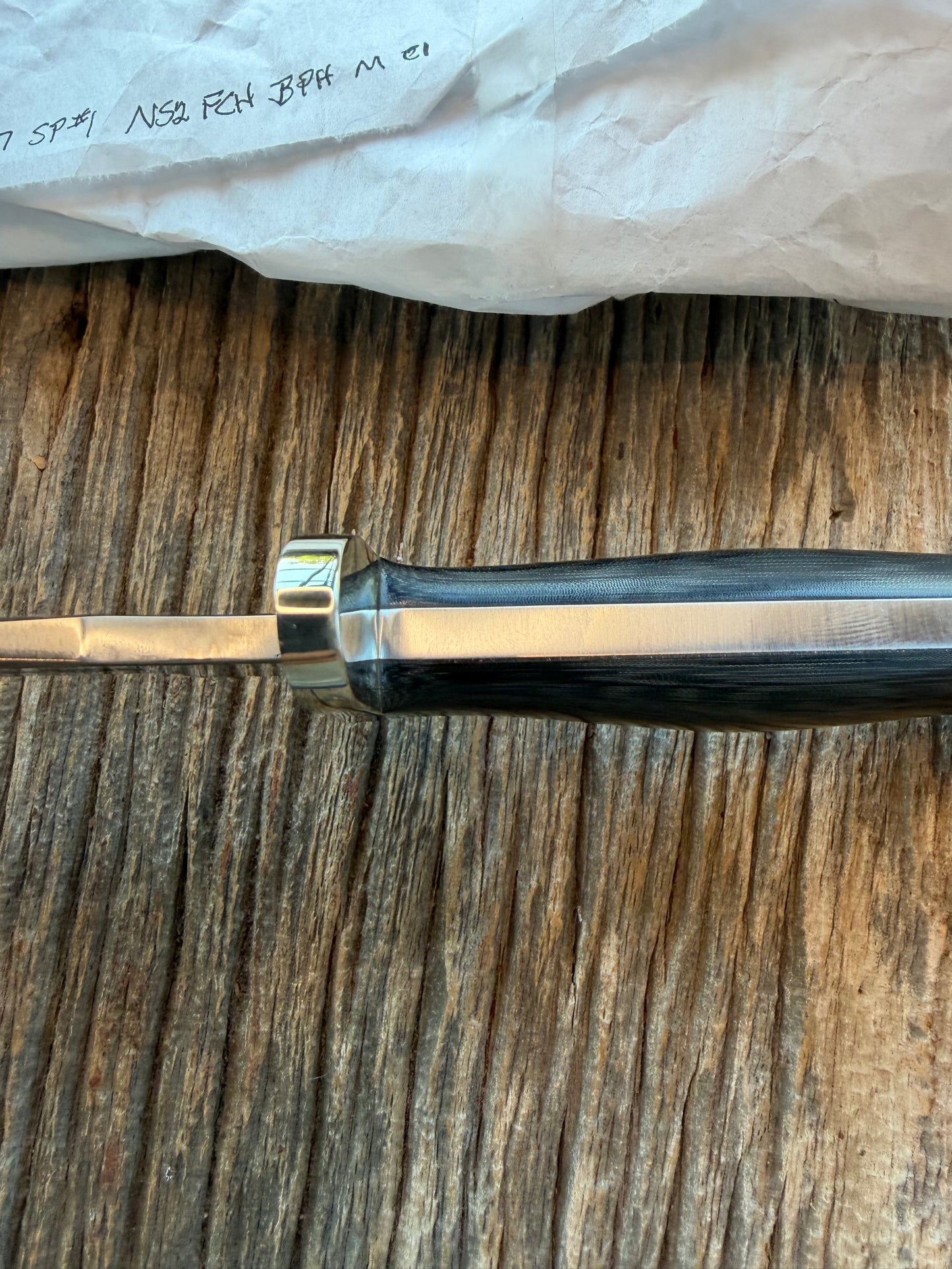 New in Paper Randall Model 16 SP#1 Special fighter with a Black Micarta handle. SS blade, Nickel silver Forward Curved hilt. Lanyard. Brown leather sheath.