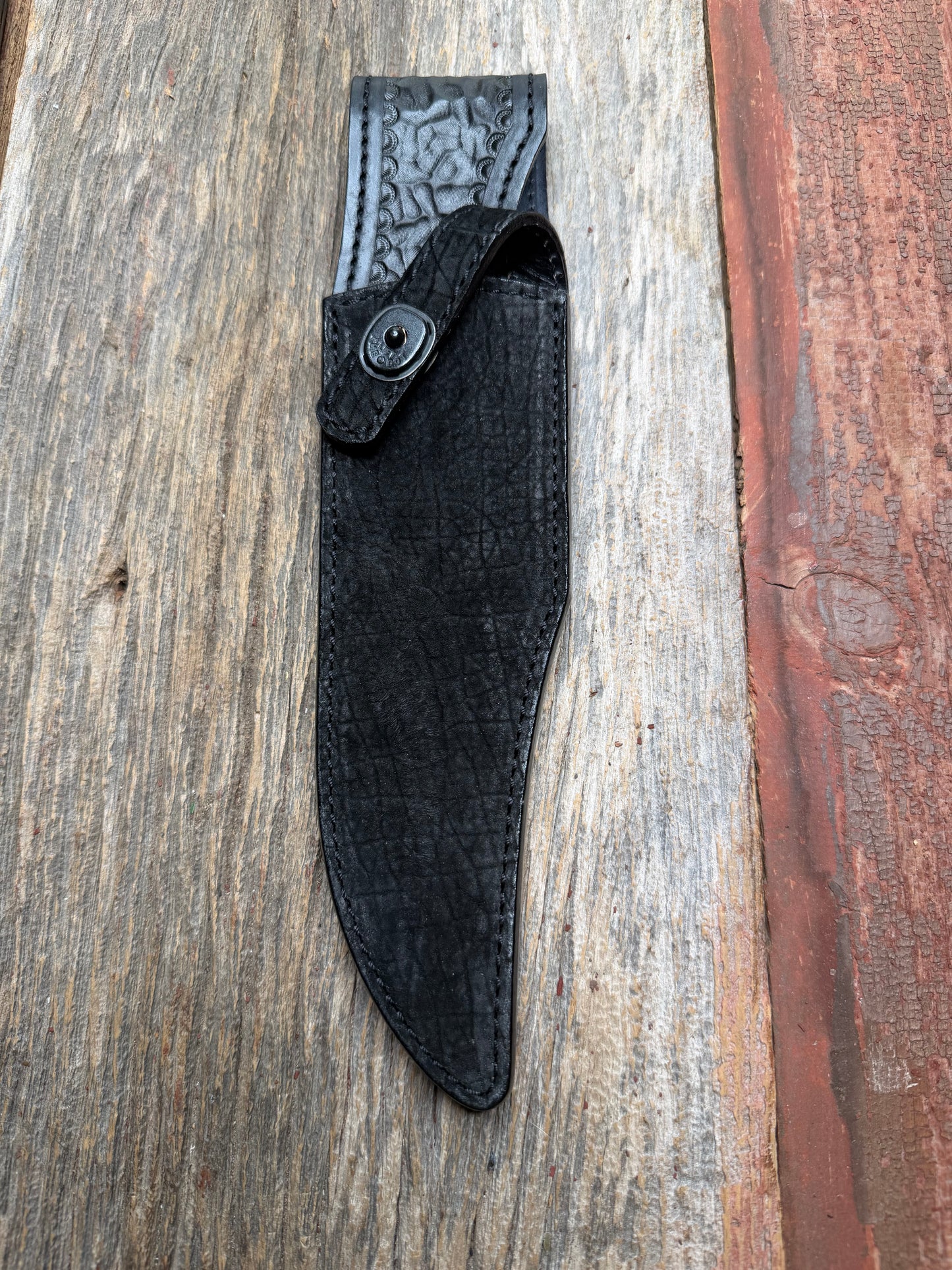 Randall Model 12-8 “Big Bear” in Black Hippo, forward curved hilt, black Canteen Snap, full brass stamping and stitching.